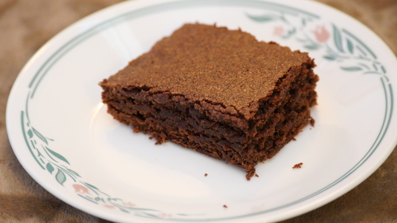  A picture of a brownie square on a plate