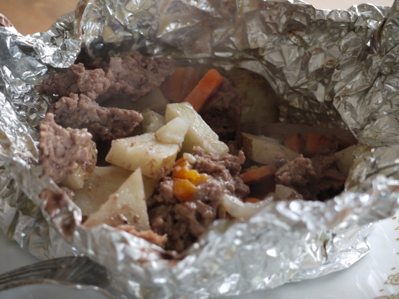 A picture of tinfoil potatoes in foil.