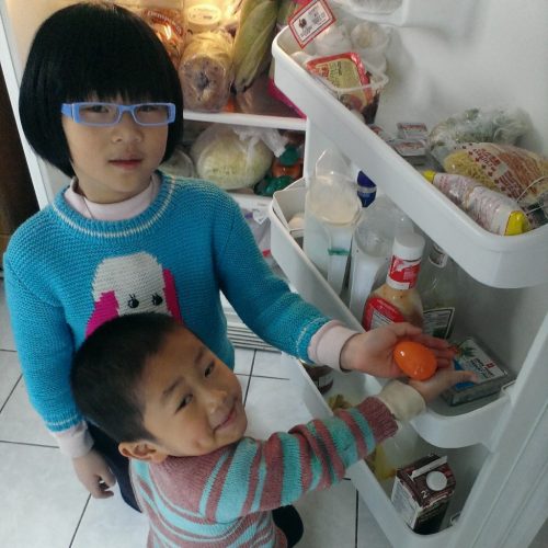 Easter egg hunting. They found one in the fridge!