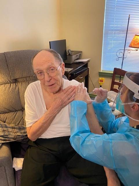 The Glebe senior living distributing COVID19 vaccine to senior male resident