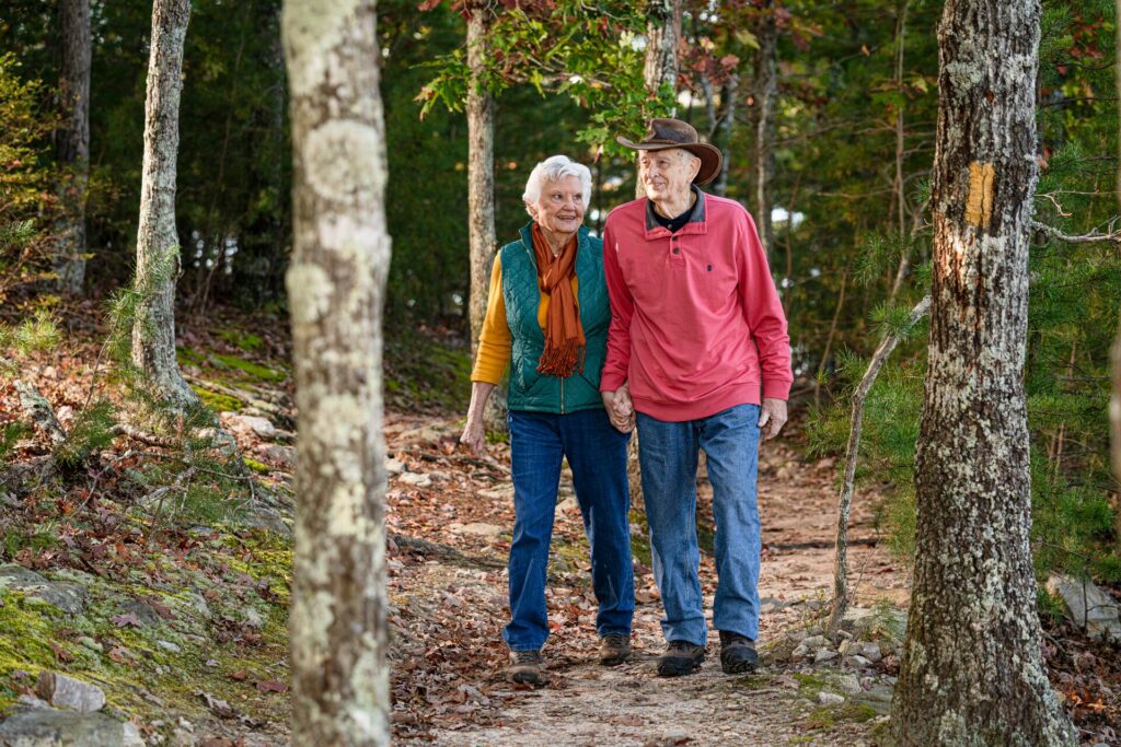 Senior couple going for a walk through nature