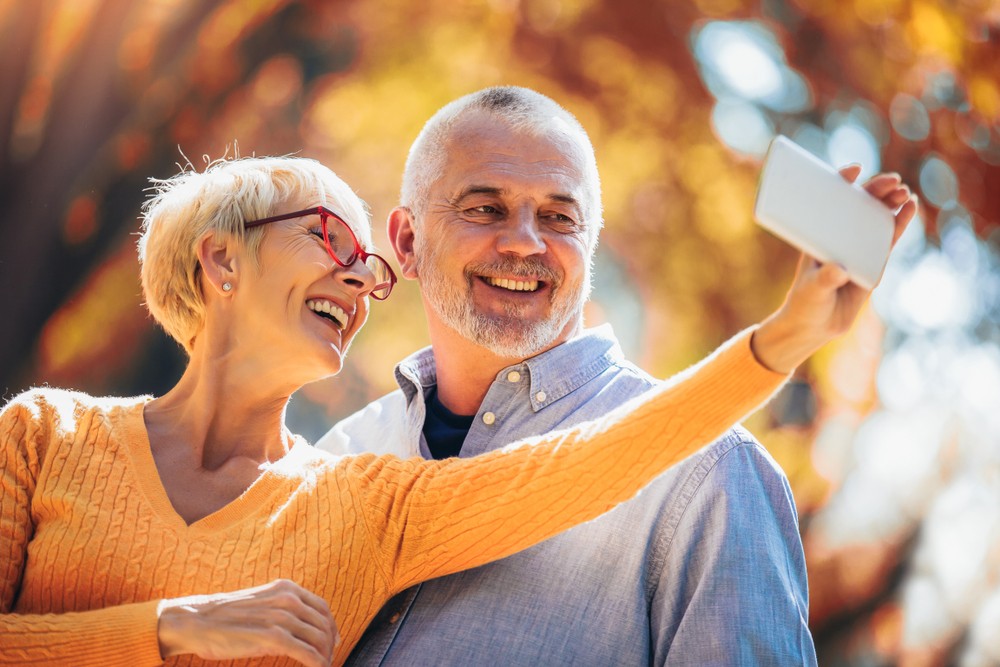Senior couple taking selfie together