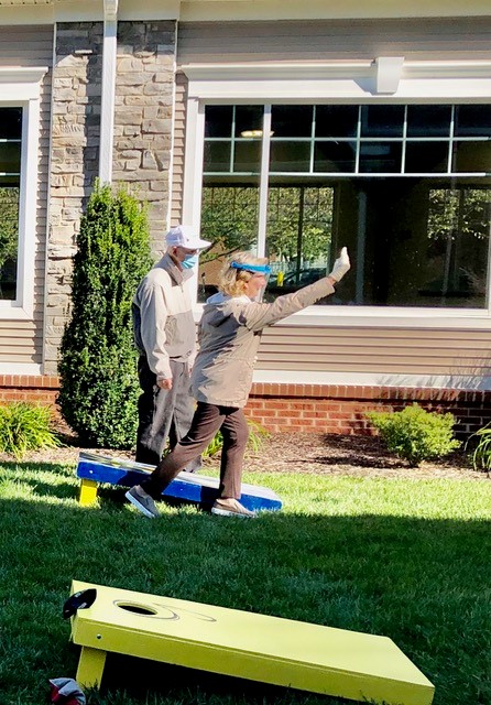 seniors playing cornhole at the Glebe retirement community