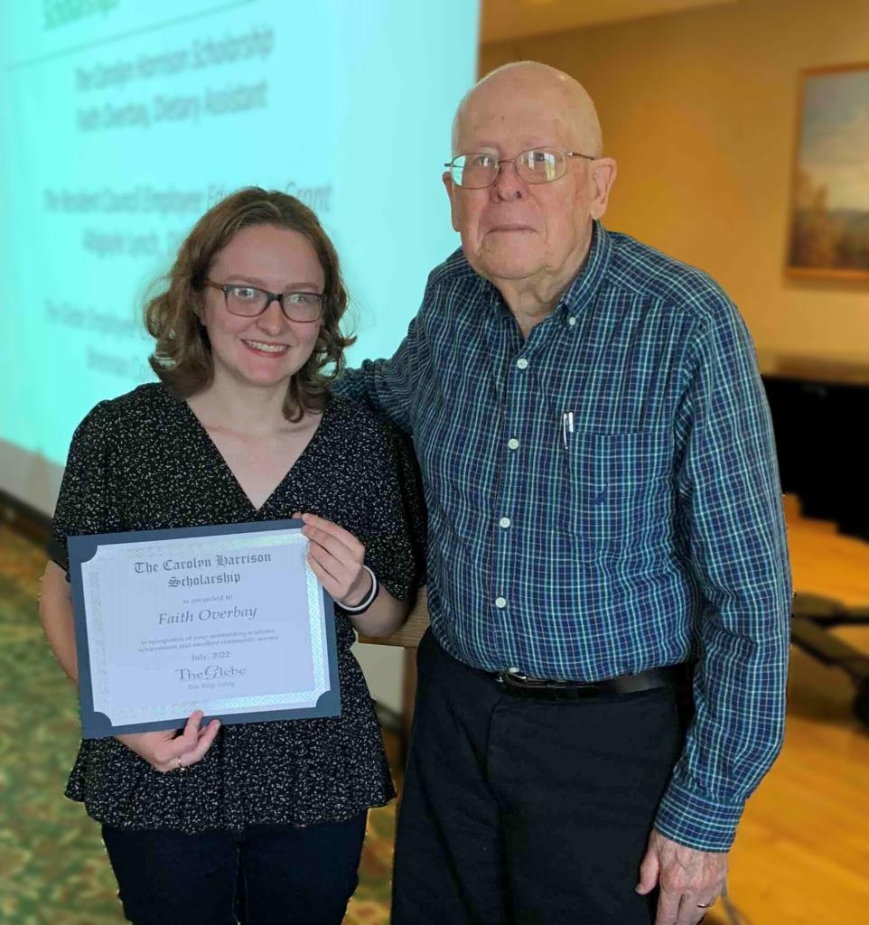 Scholarship Recipient Overbay accepting her scholarship from The Glebe