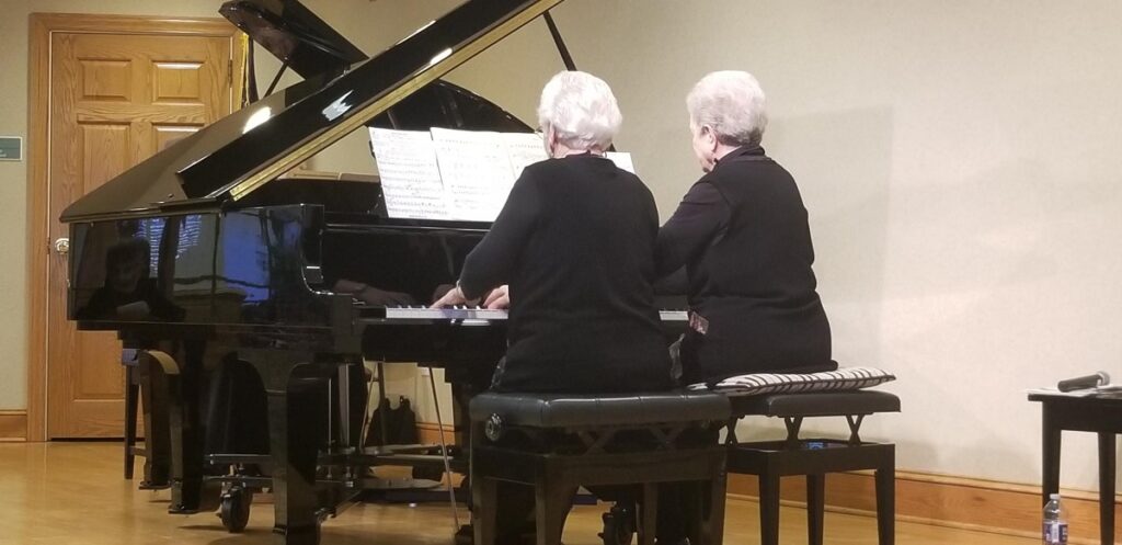 Seniors playing the piano