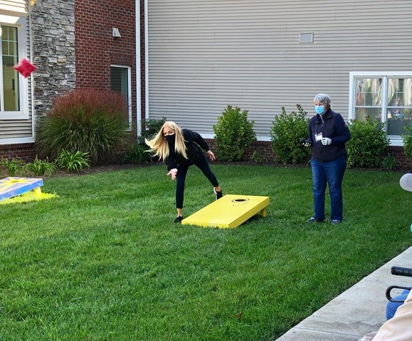 seniors playing cornhole at the Glebe retirement community