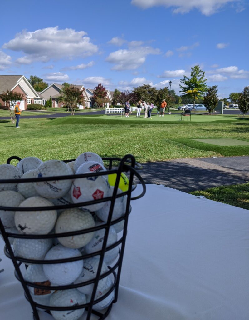 Close up of a basket of golf balls.