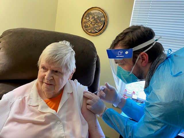 Medical team member giving The Glebe senior resident Covid19 vaccination