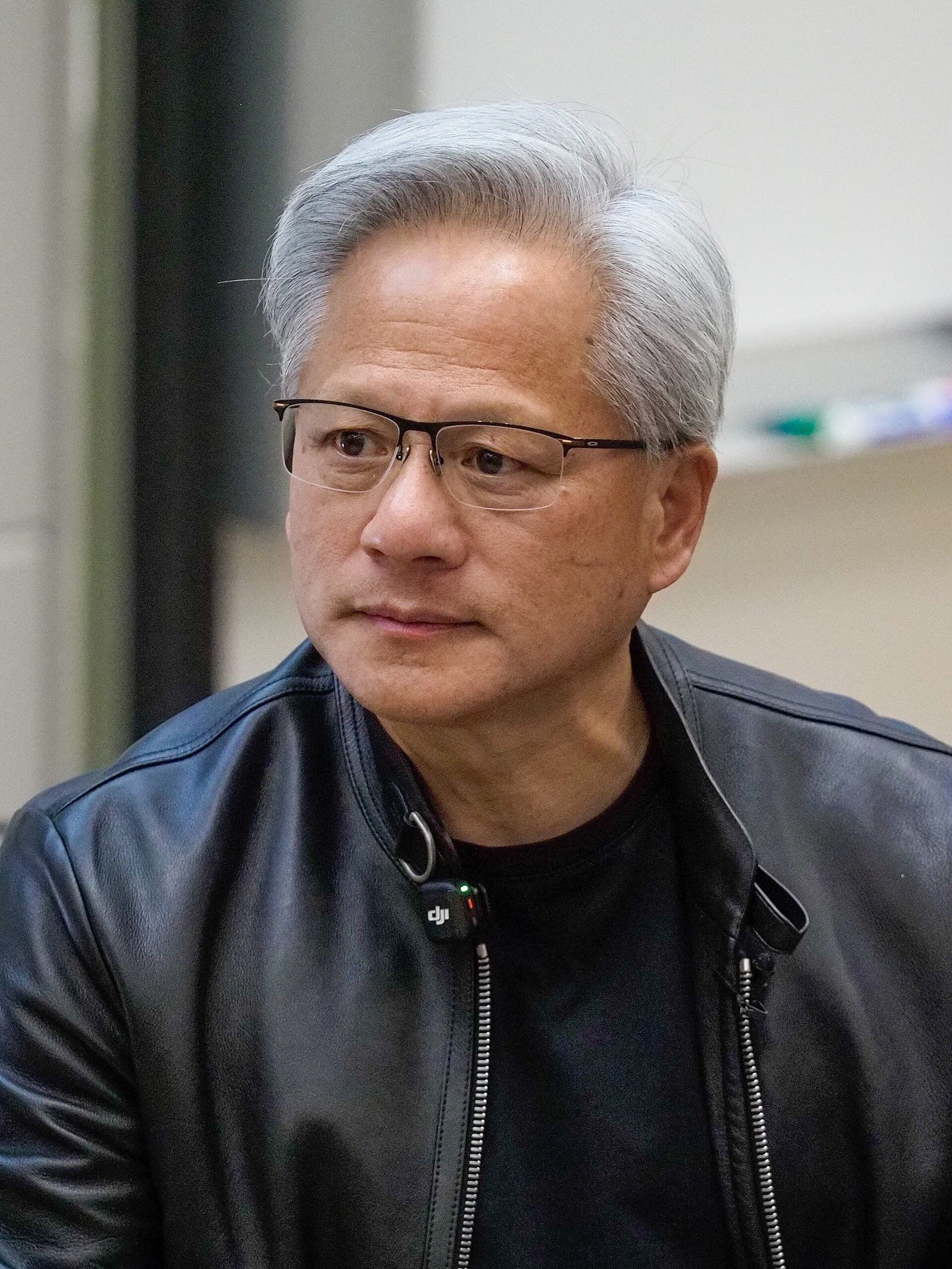 Nvidia chief executive Jensen Huang in a black leather jacket and glasses, photographed close up at Stanford