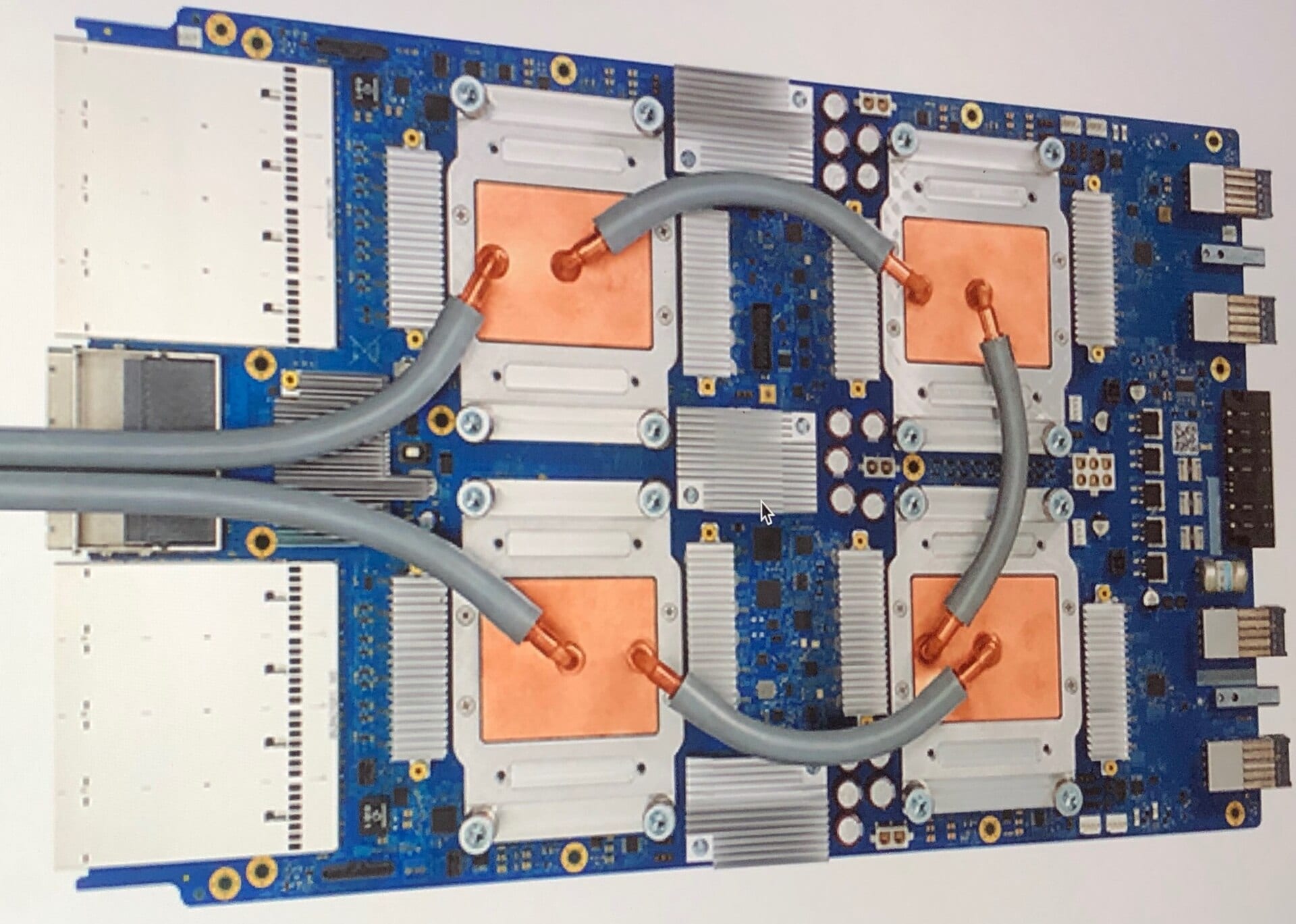 A Google Tensor Processing Unit 3.0 accelerator board with four liquid-cooled processor modules