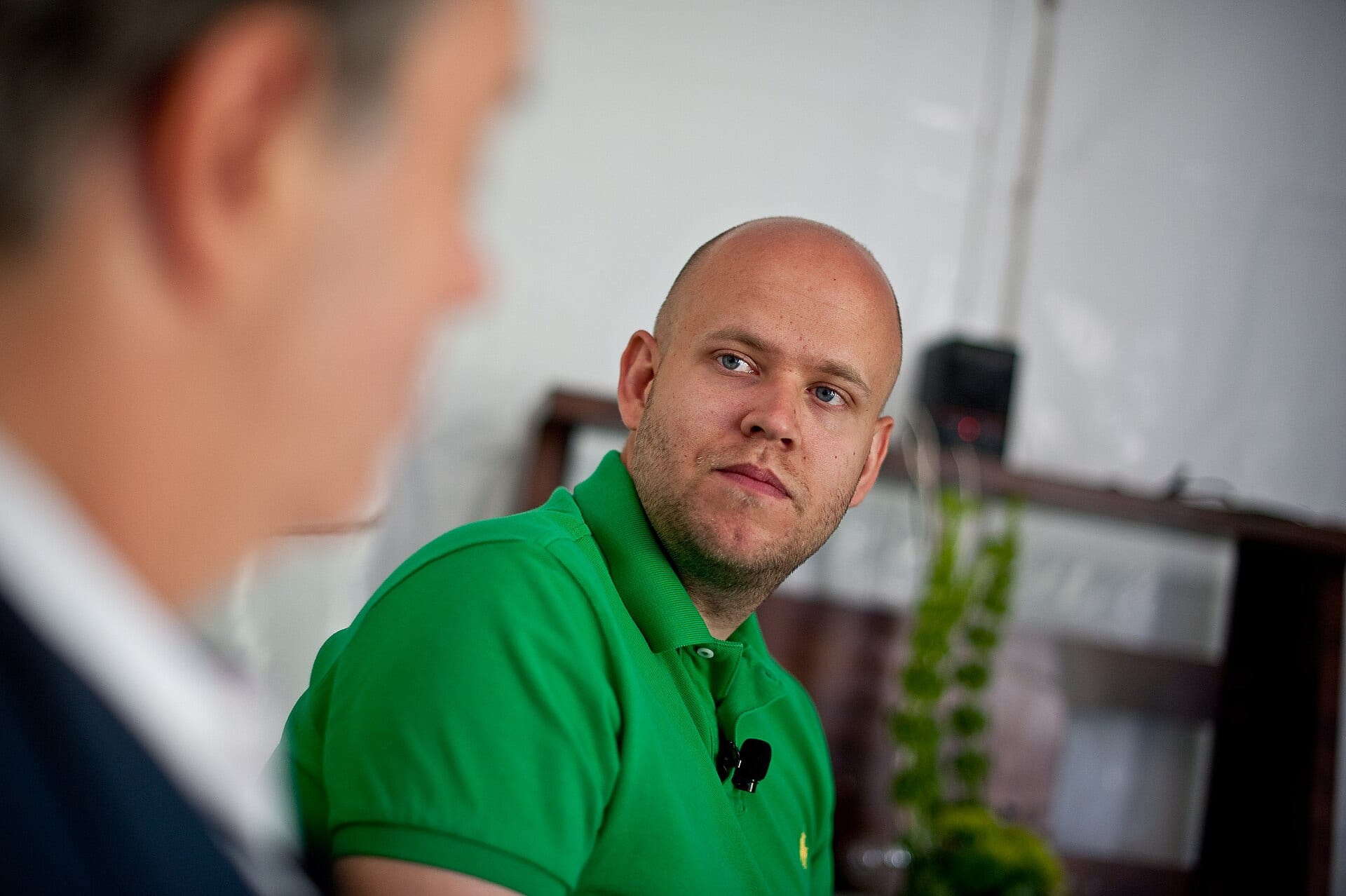 Daniel Ek, Spotify's founder, in a green polo shirt during an on-stage interview at the Fortune Brainstorm TECH conference in 2011.