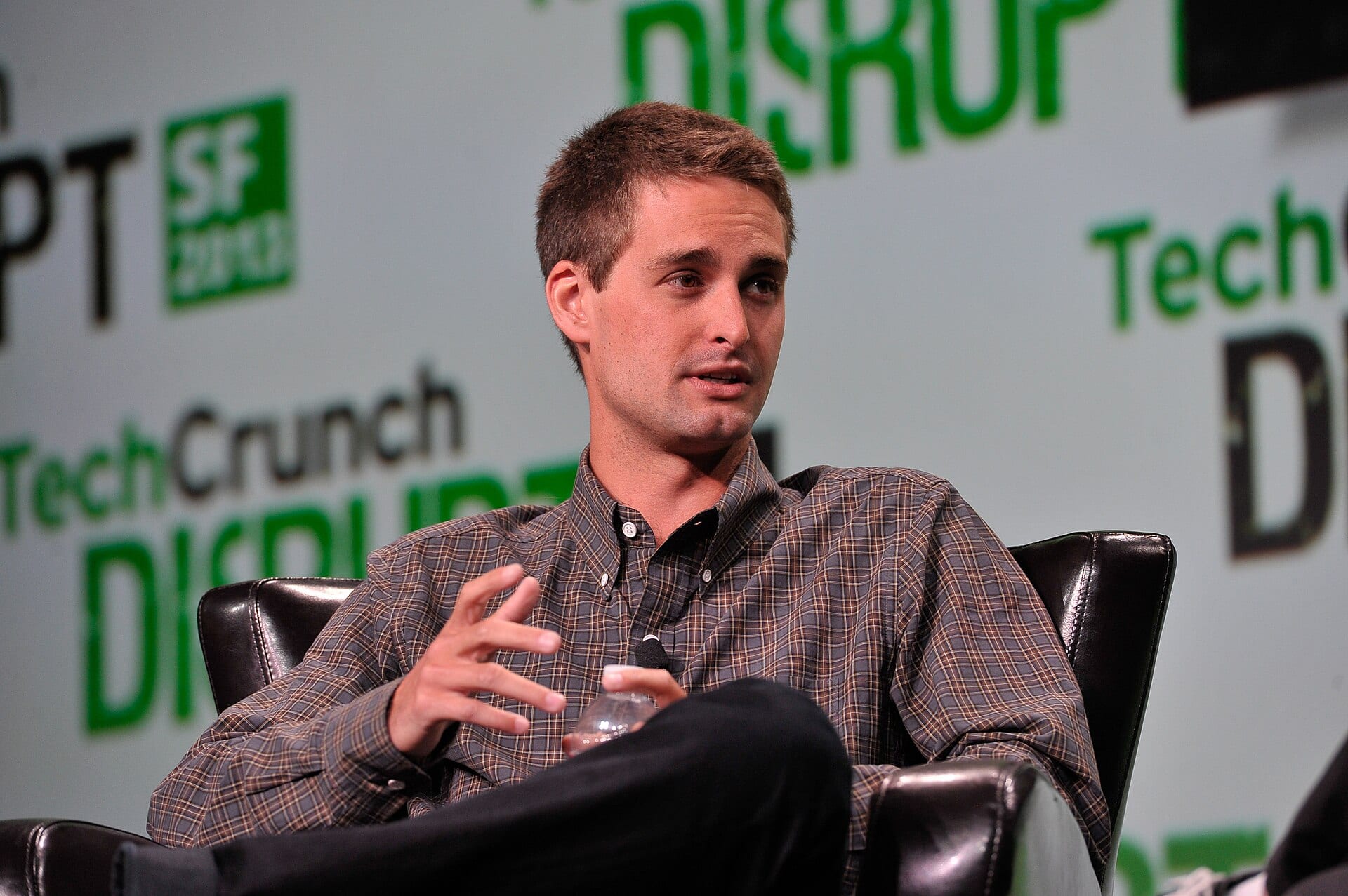 Snap co-founder and CEO Evan Spiegel speaking on stage at a TechCrunch Disrupt panel