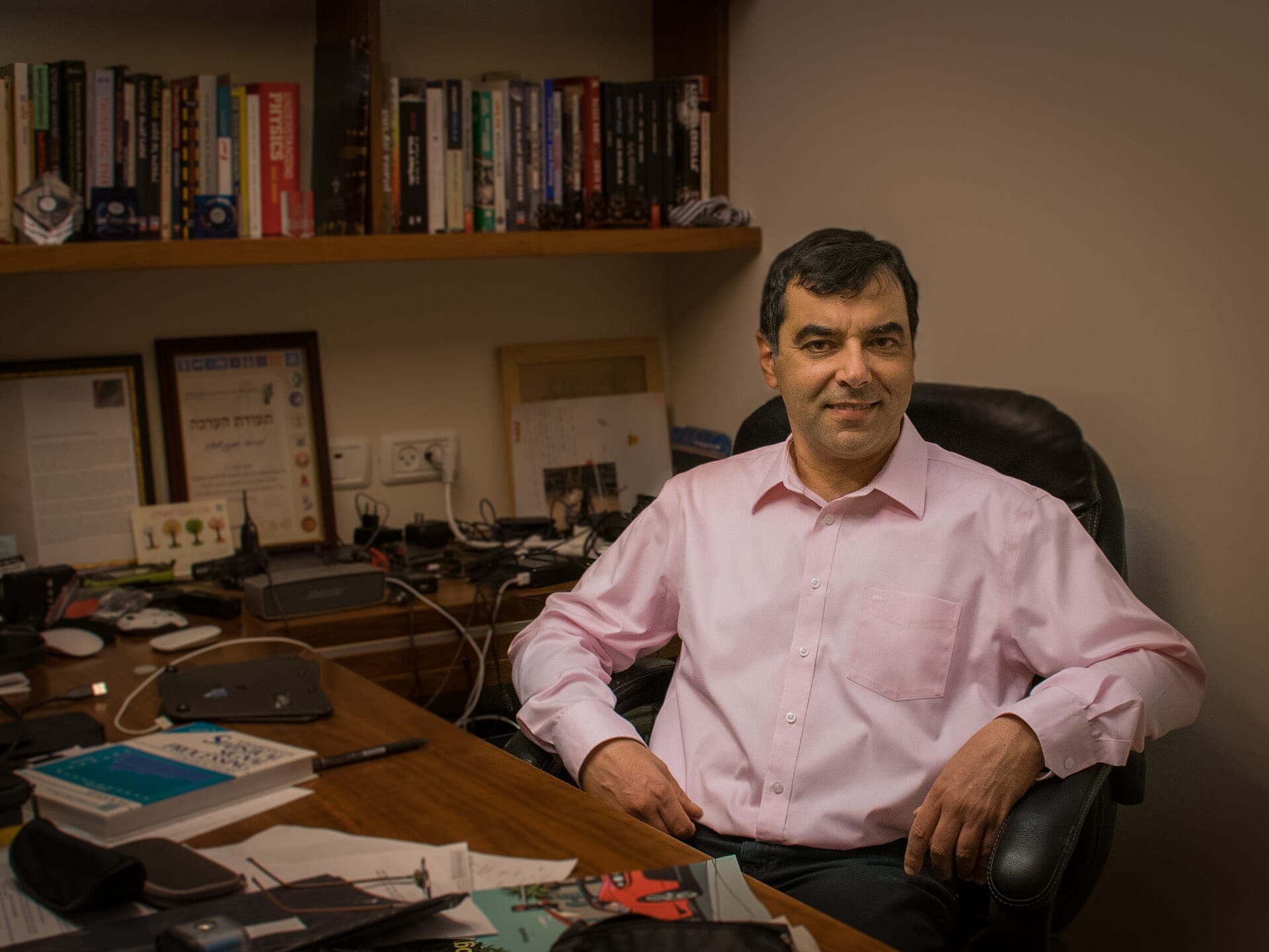 Amnon Shashua, Mobileye's founder, seated at his desk in his office