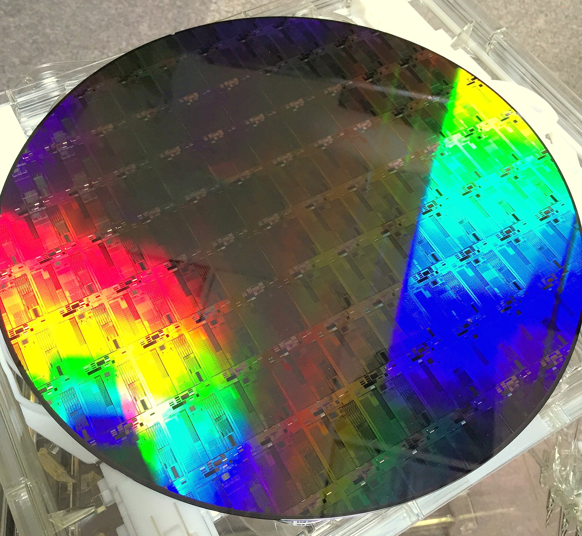 A 300mm silicon photonics wafer with iridescent patterned dies