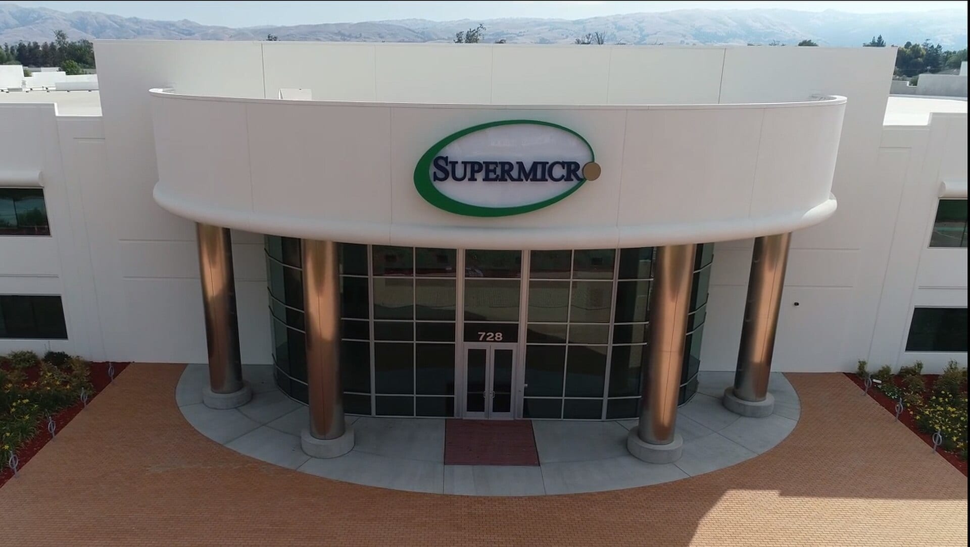 Super Micro's Green Computing Park campus entrance, with the company's logo above glass doors