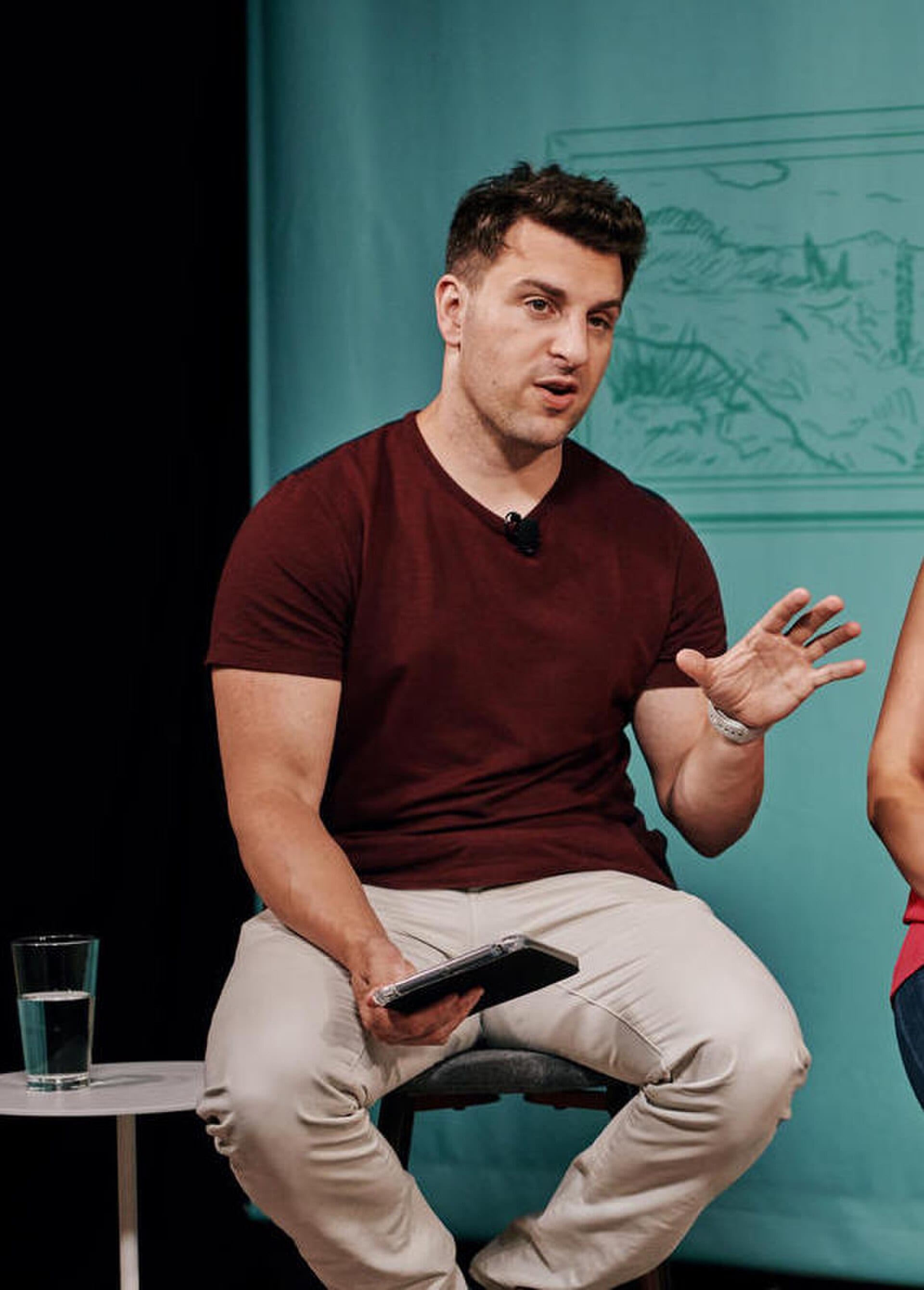 Airbnb co-founder and chief executive Brian Chesky speaking on stage