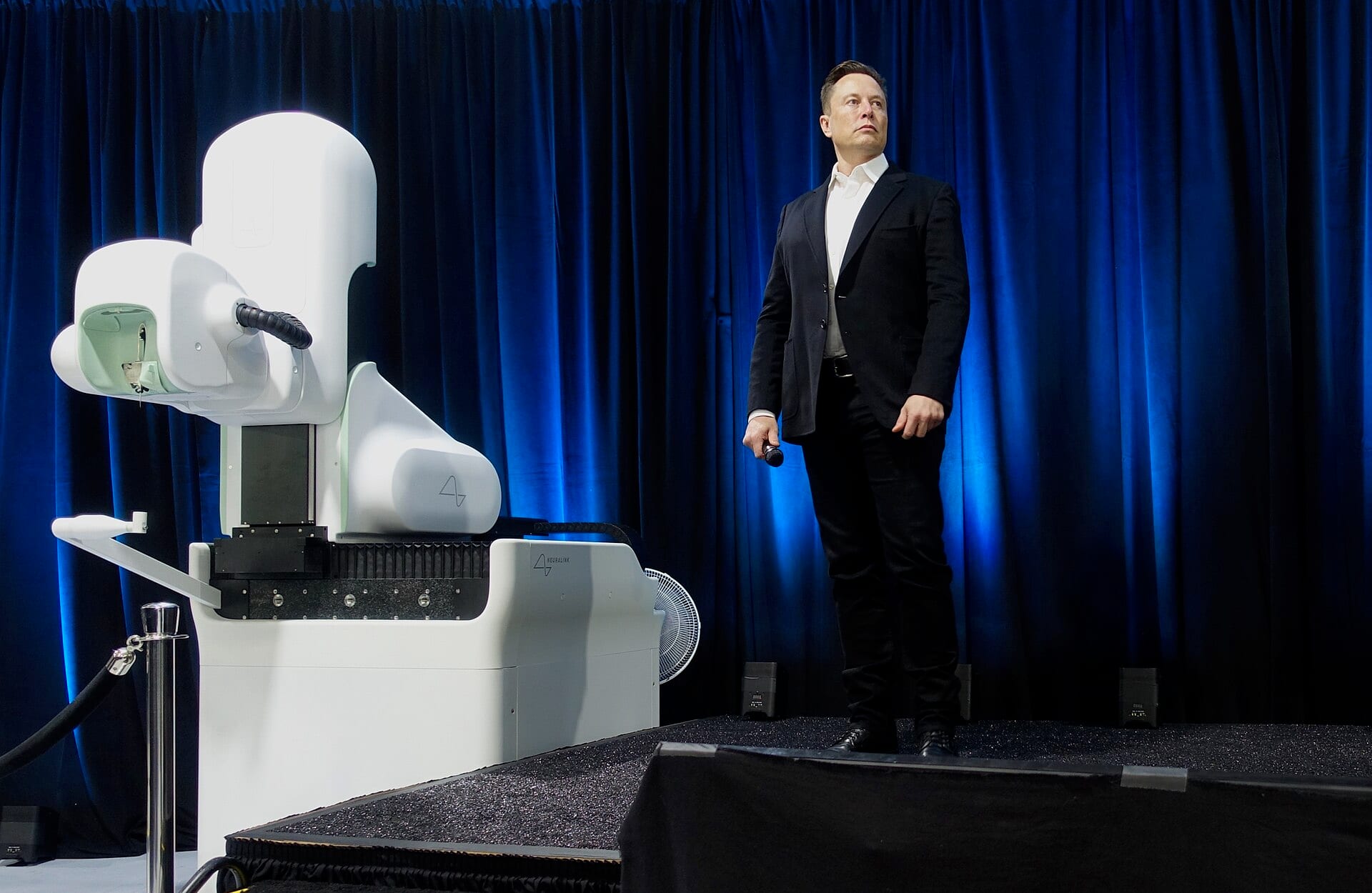 Elon Musk on stage at a Neuralink event in 2020