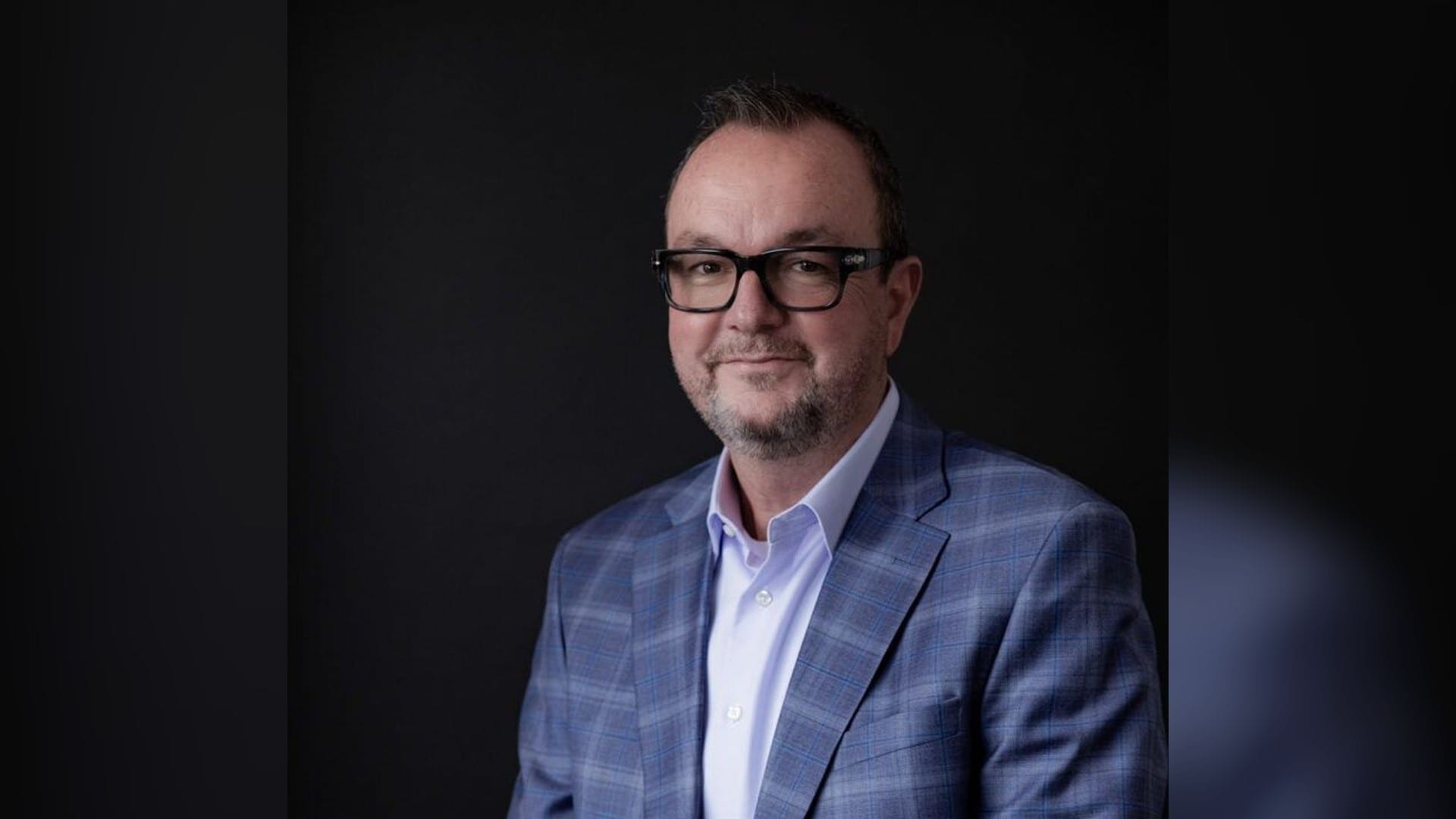 Matt Schultz, chief executive of CleanSpark, in a blue checked suit against a dark background