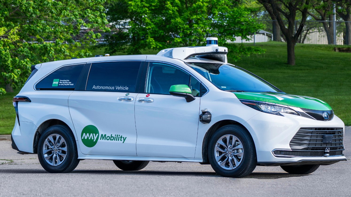 May Mobility autonomous Toyota Sienna minivan parked in Ann Arbor, Michigan, with a lidar sensor array on the roof