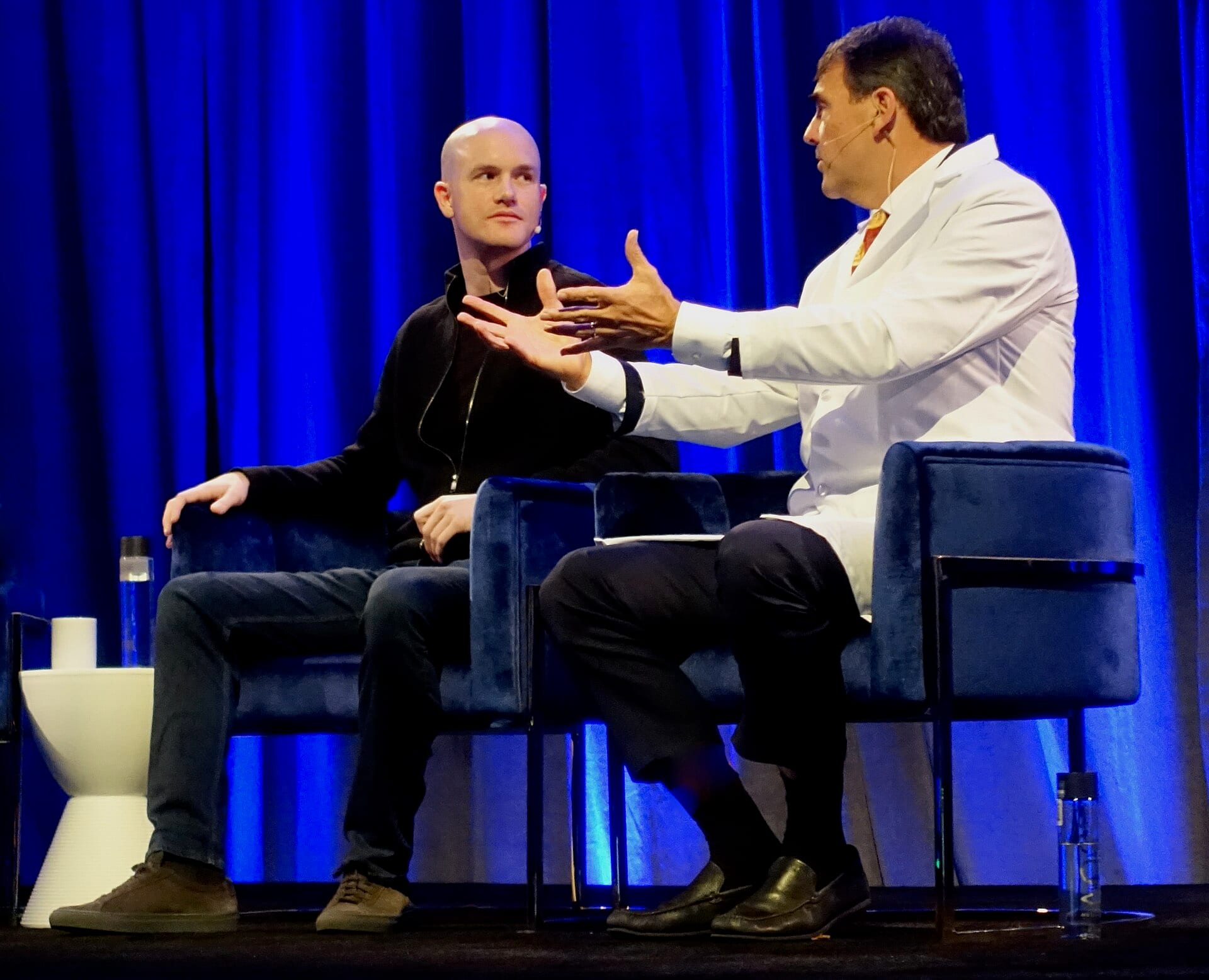 Coinbase chief executive Brian Armstrong on stage in conversation at a crypto panel
