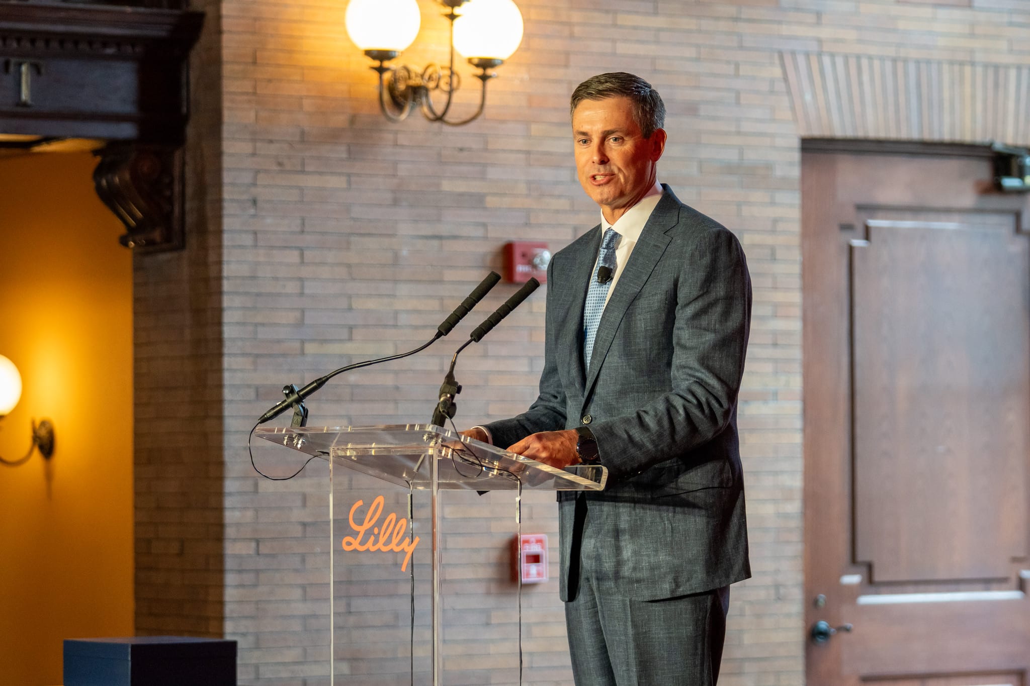 Eli Lilly chair and chief executive David A. Ricks speaking at a podium