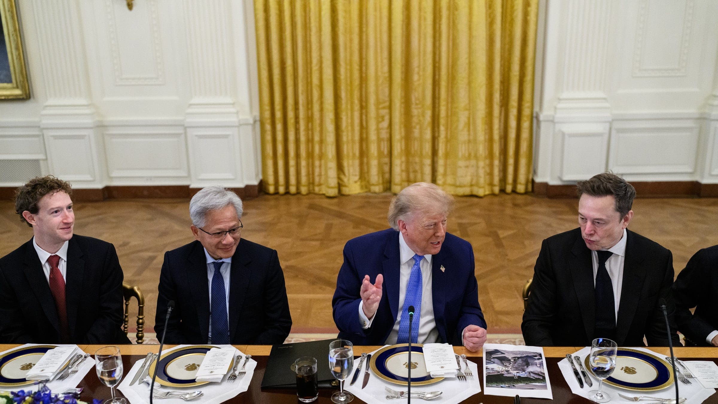 Mark Zuckerberg, Jensen Huang, Donald Trump and Elon Musk seated at a long table in the East Room of the White House