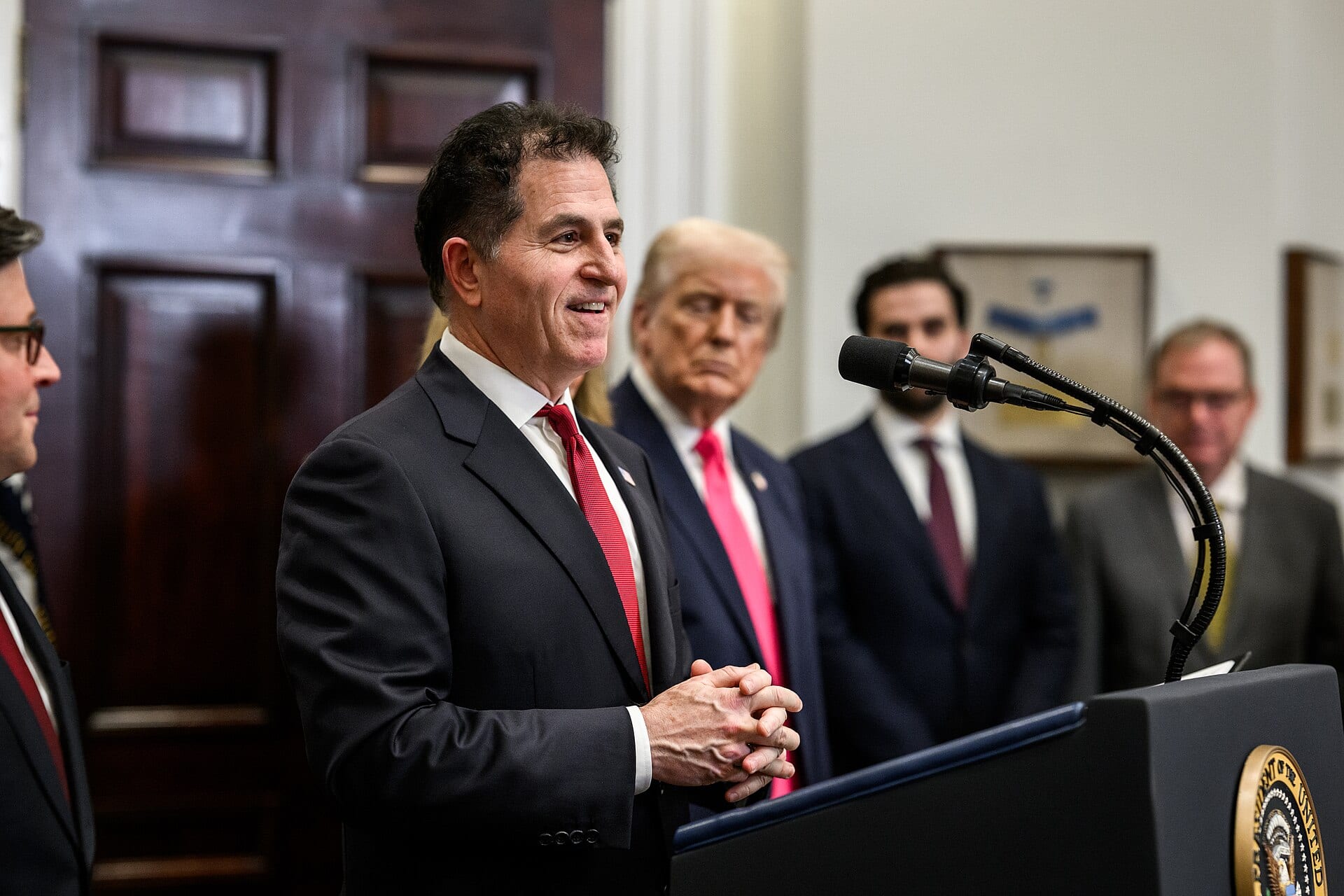 Dell Technologies chief executive Michael Dell speaking at a podium during a White House event in December 2025.