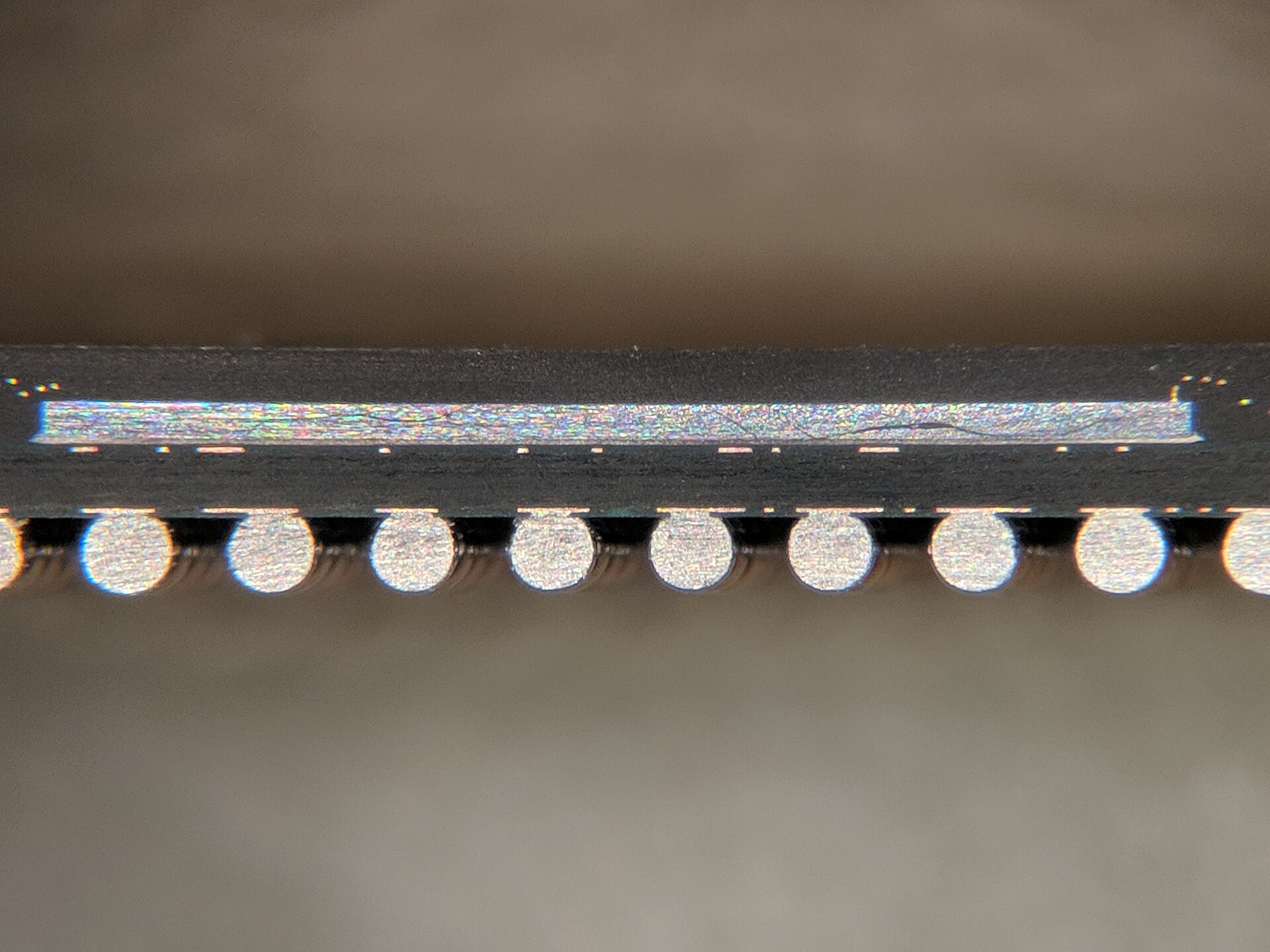 Cross-section of a ball grid array chip package showing the silicon die, the laminate substrate beneath it and the solder balls