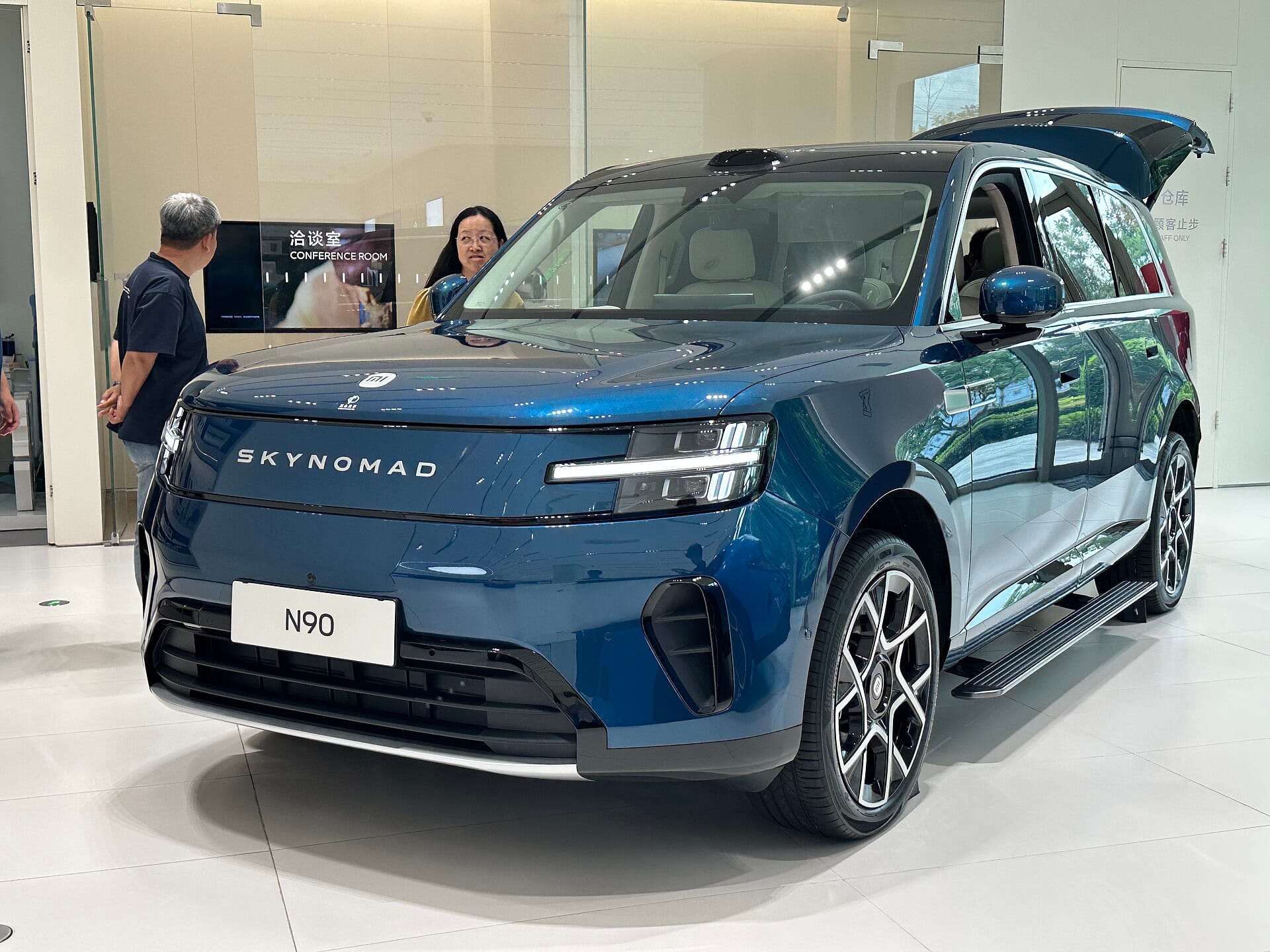 Xiaomi's SkyNomad N90 extended-range SUV in a Xiaomi showroom