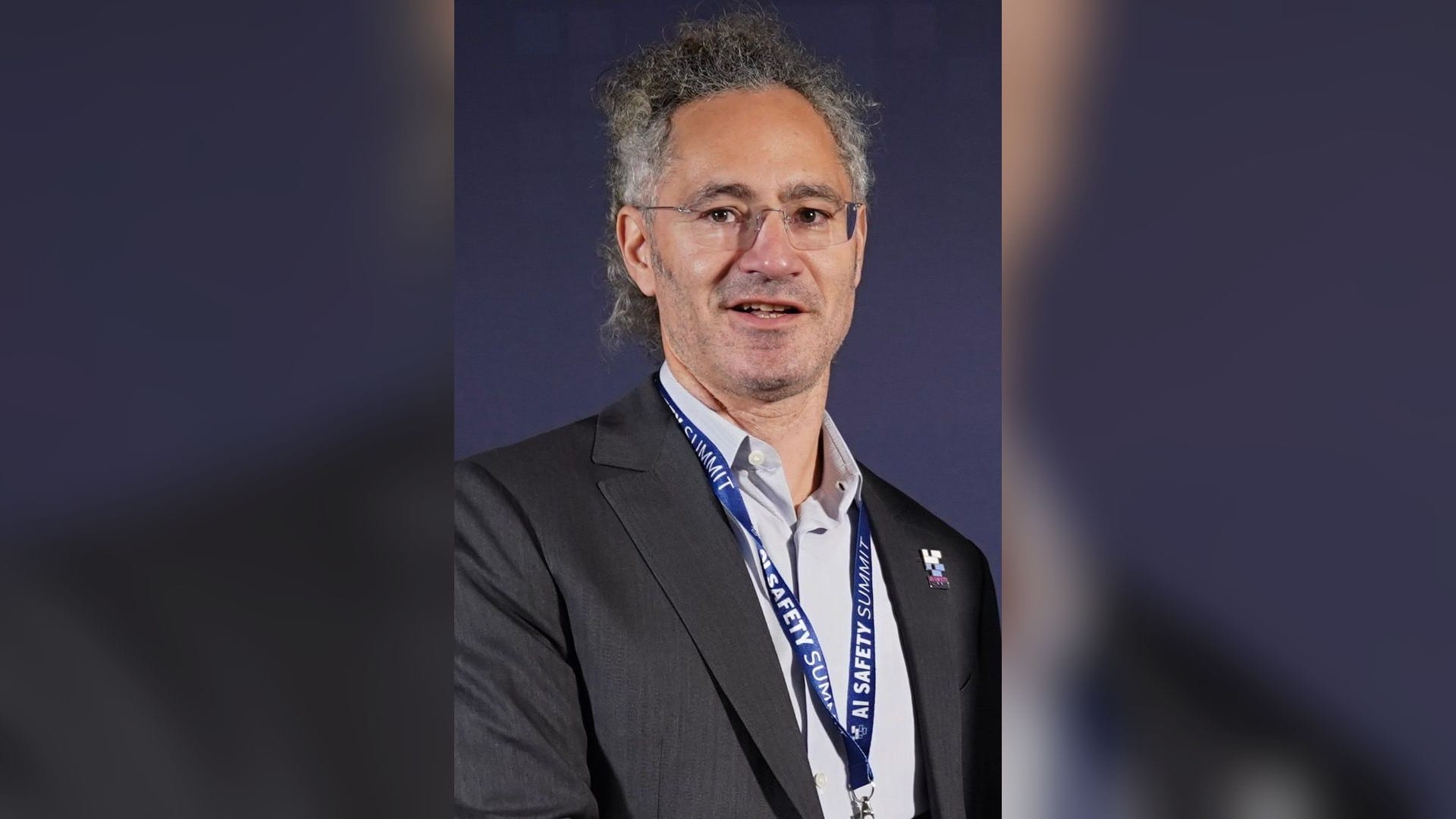 Alex Karp, chief executive of Palantir, wearing an AI Safety Summit lanyard