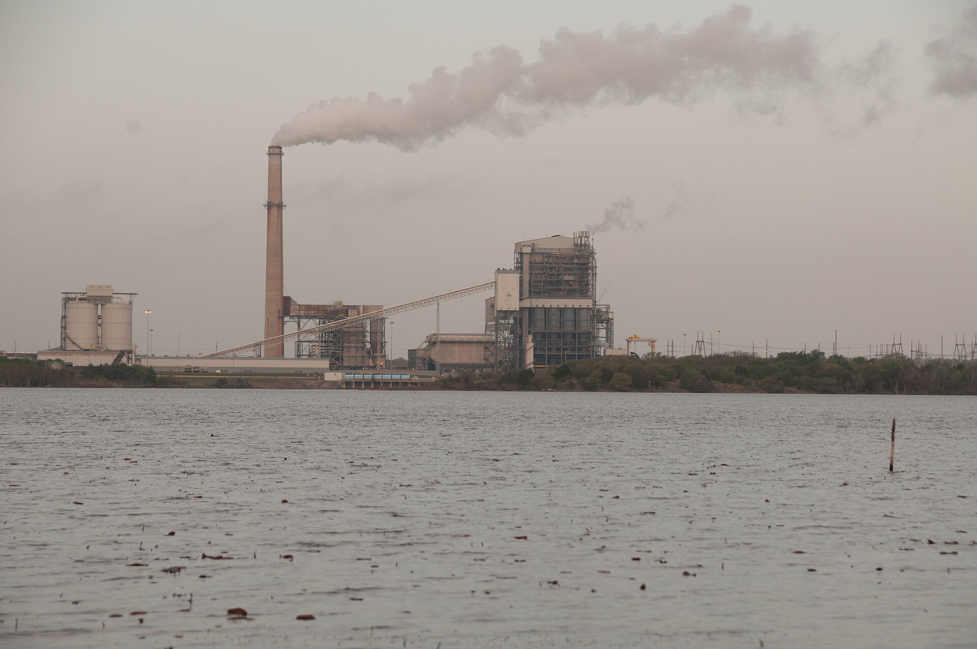 The former Gibbons Creek coal power plant across its reservoir in Grimes County, Texas