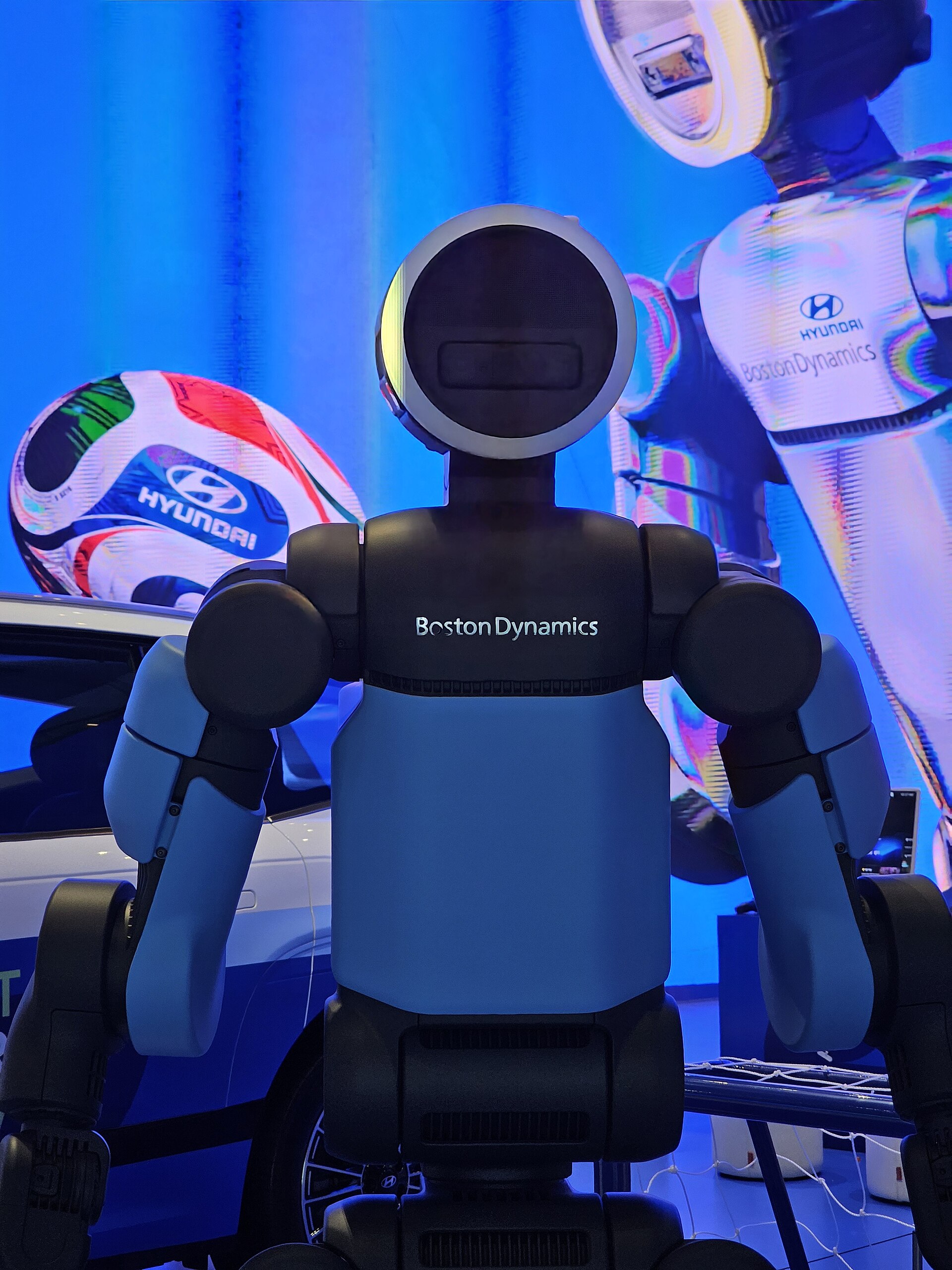Boston Dynamics' Atlas humanoid robot facing the camera, the company's name on its chest