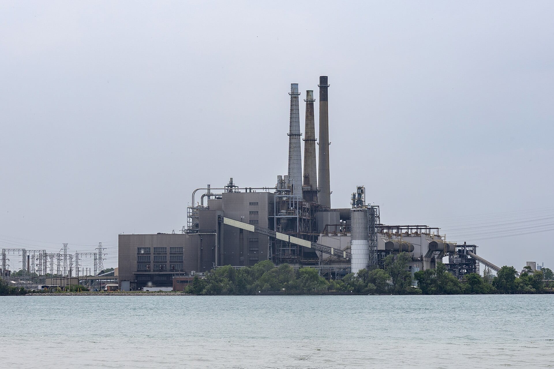 DTE Energy's River Rouge power plant on the Detroit River, with transmission lines at left