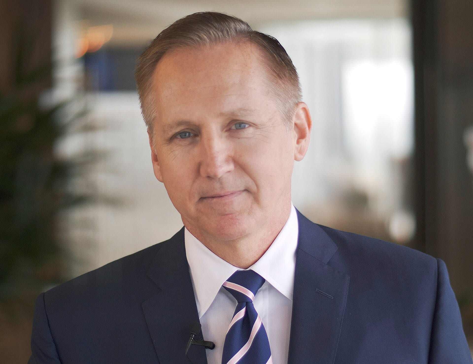 Jeffrey W. Martin, Sempra's chief executive, in a navy suit and striped tie during an interview