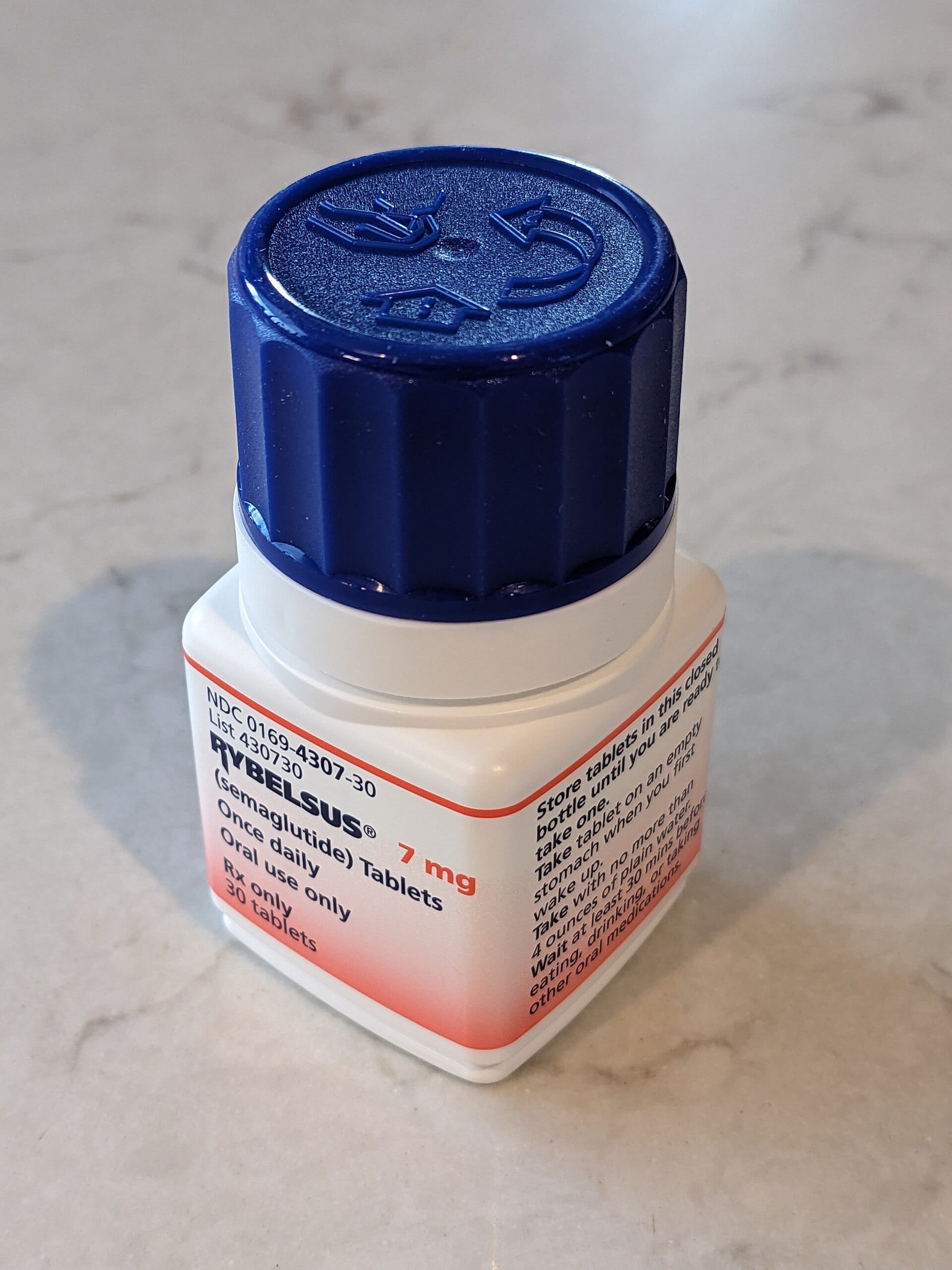 A bottle of Rybelsus, Novo Nordisk's oral semaglutide tablet, on a marble counter
