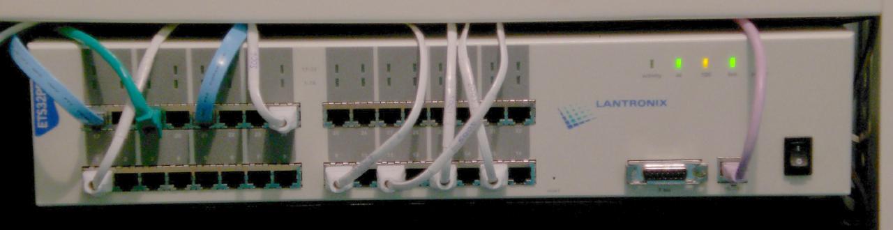 A Lantronix ETS32PR console server mounted in a rack with network cables