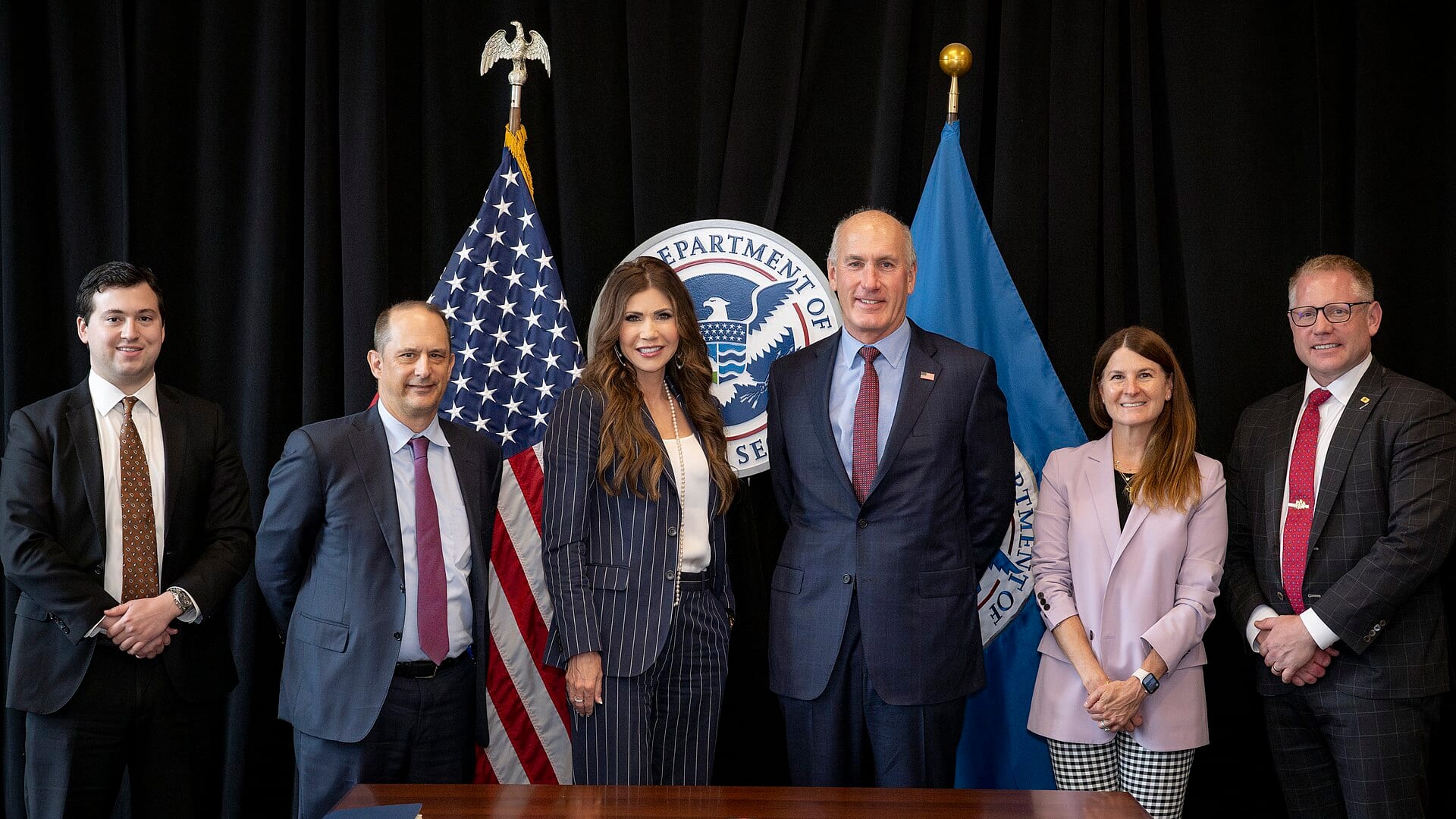 John Stankey, chief executive of AT&T, in a group photo at the Department of Homeland Security
