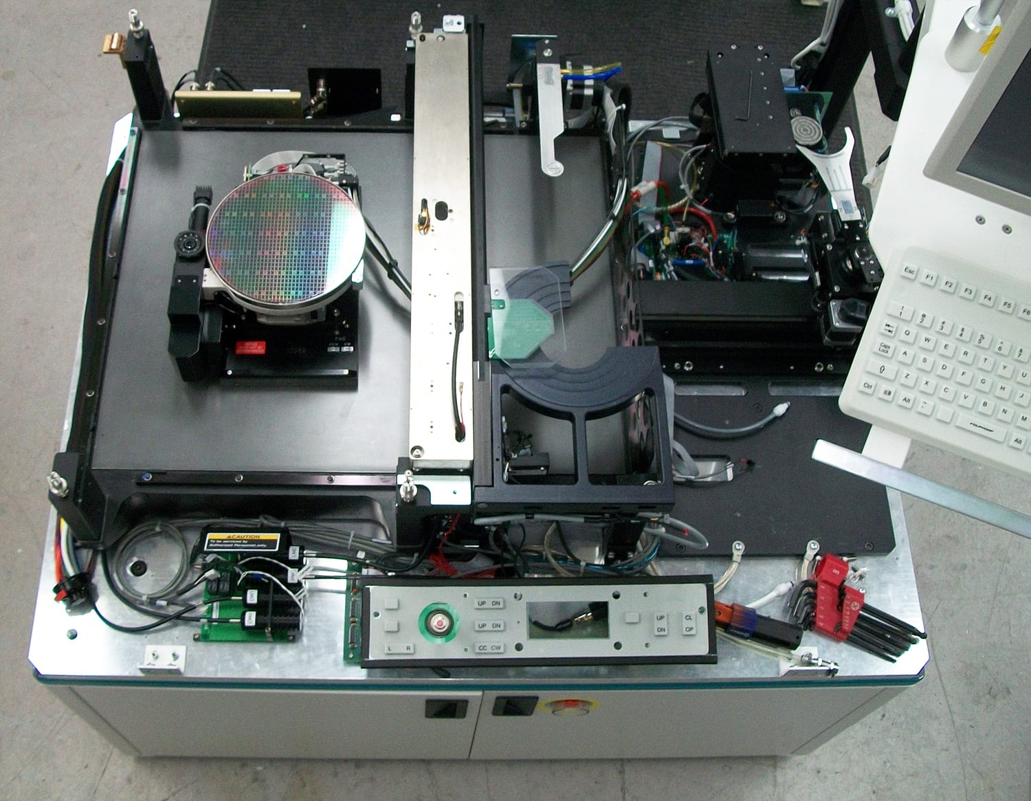 A wafer prober in service configuration with a silicon wafer mounted on its test chuck