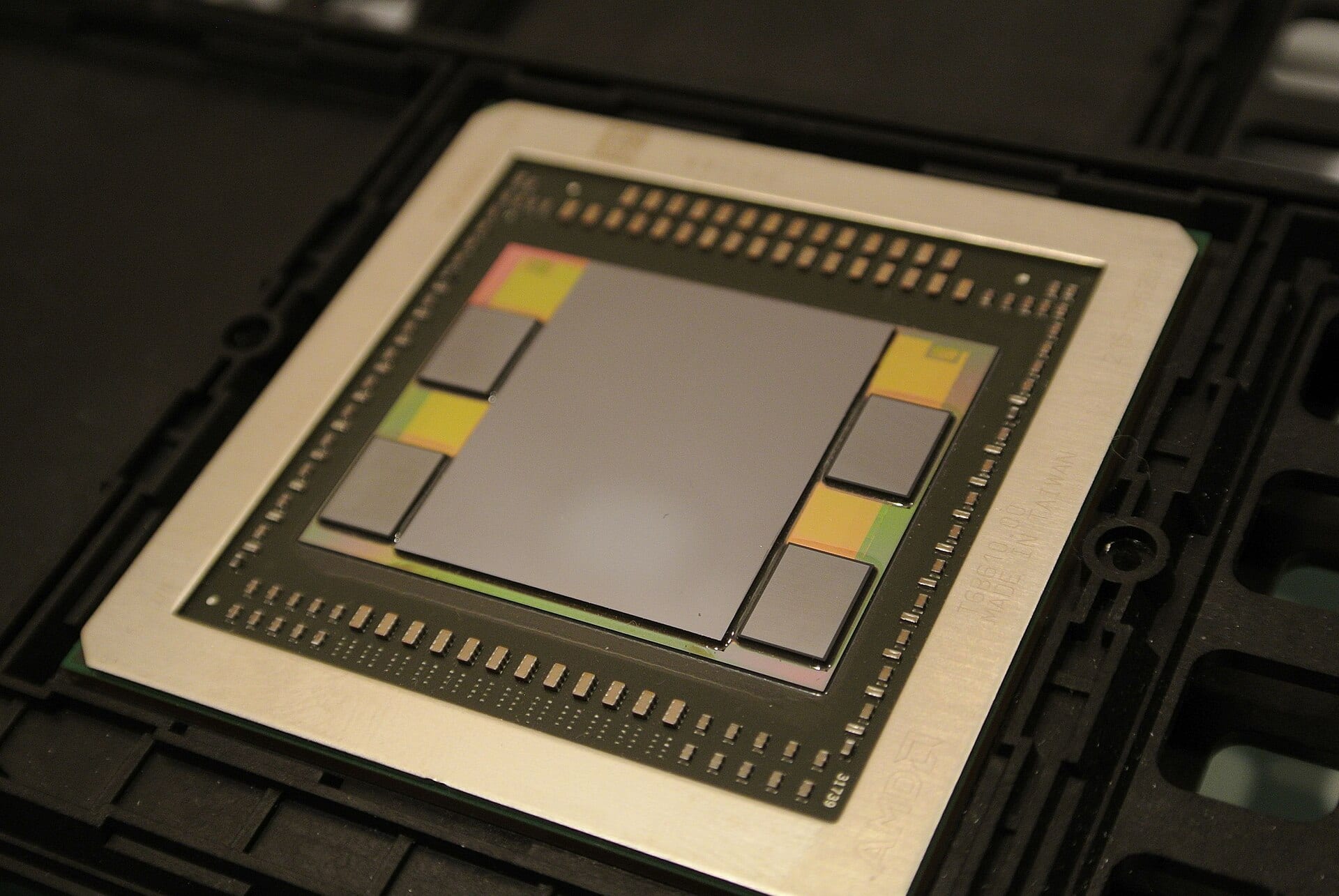 HBM memory dies stacked beside a GPU die on an interposer, the package Hanmi Semiconductor's thermal-compression bonders build