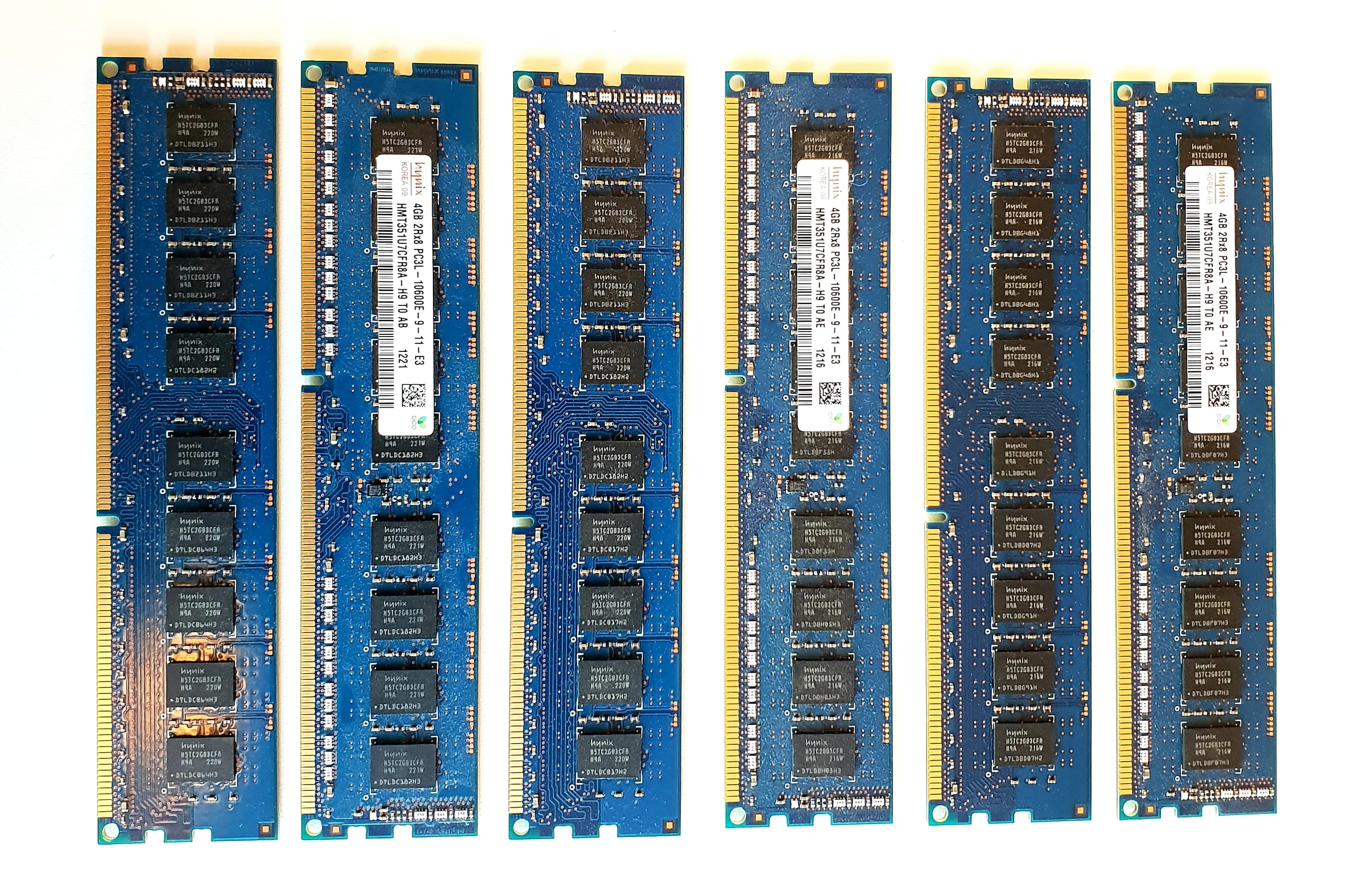 Six Hynix DDR3 memory modules lined up on a white surface, DRAM chips visible on each blue circuit board