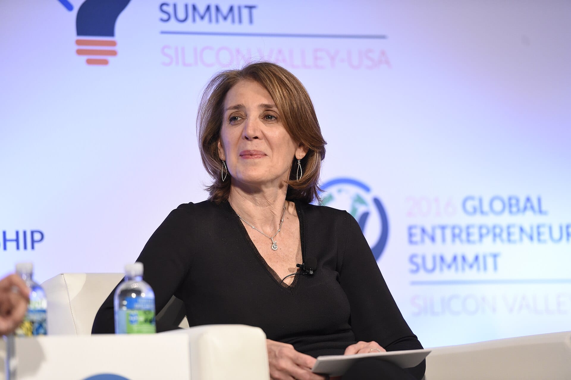 Ruth Porat, Google's president and chief investment officer, seated on a panel stage at the 2016 Global Entrepreneurship Summit