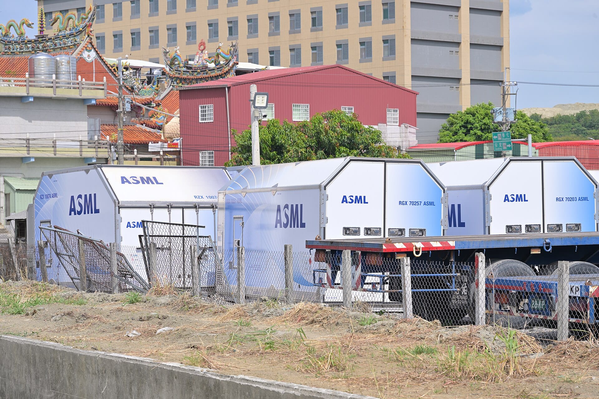 ASML-branded air freight containers used to ship lithography machines, staged on a lot in Tainan, Taiwan