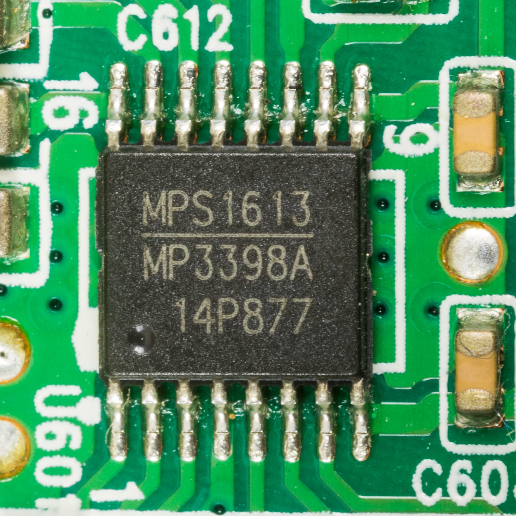 A Monolithic Power Systems MPS1613 power chip soldered to a green printed circuit board