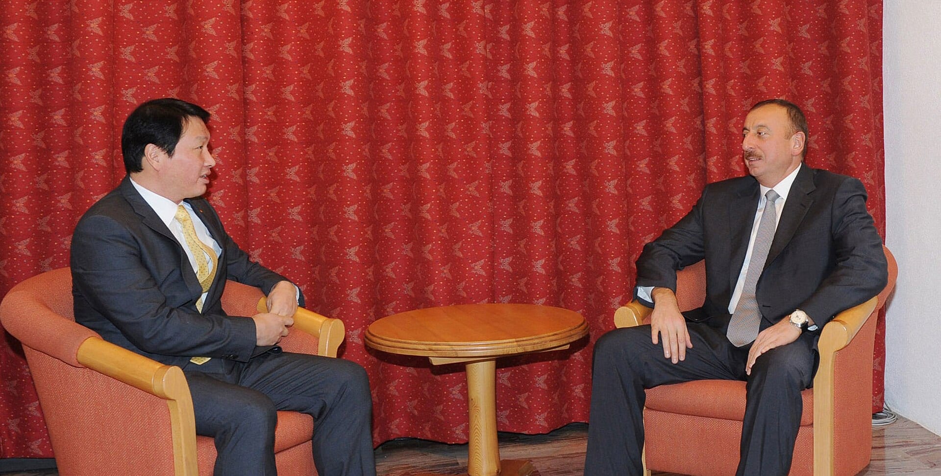 SK Group chairman Chey Tae-won, left, in a meeting
