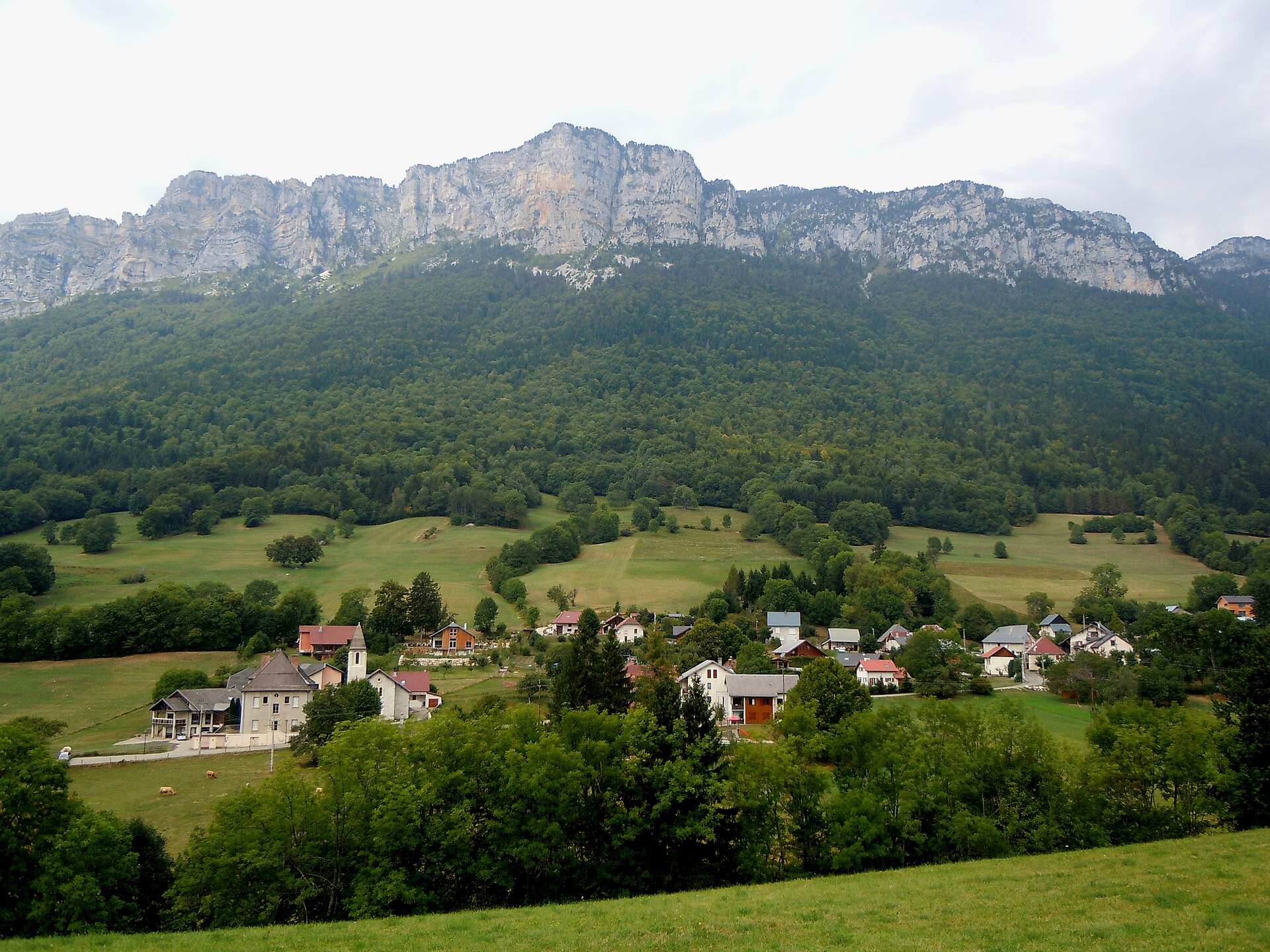 Sainte-Marie-du-Mont in the Chartreuse mountains, Isère, a village of pitched roofs under limestone cliffs