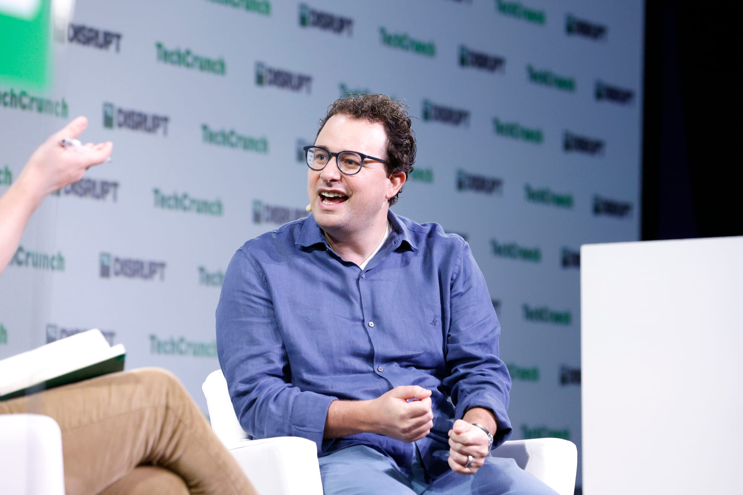 Anthropic CEO Dario Amodei speaking on stage at TechCrunch Disrupt 2023