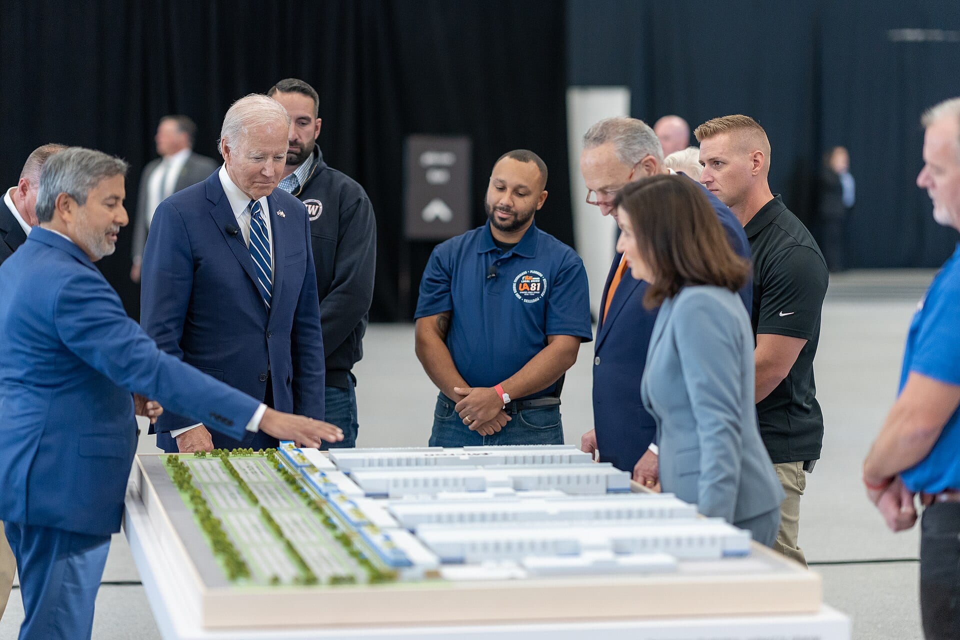 Sanjay Mehrotra, Micron's chief executive, shows President Joe Biden a model of Micron's planned New York fab complex in October 2022.