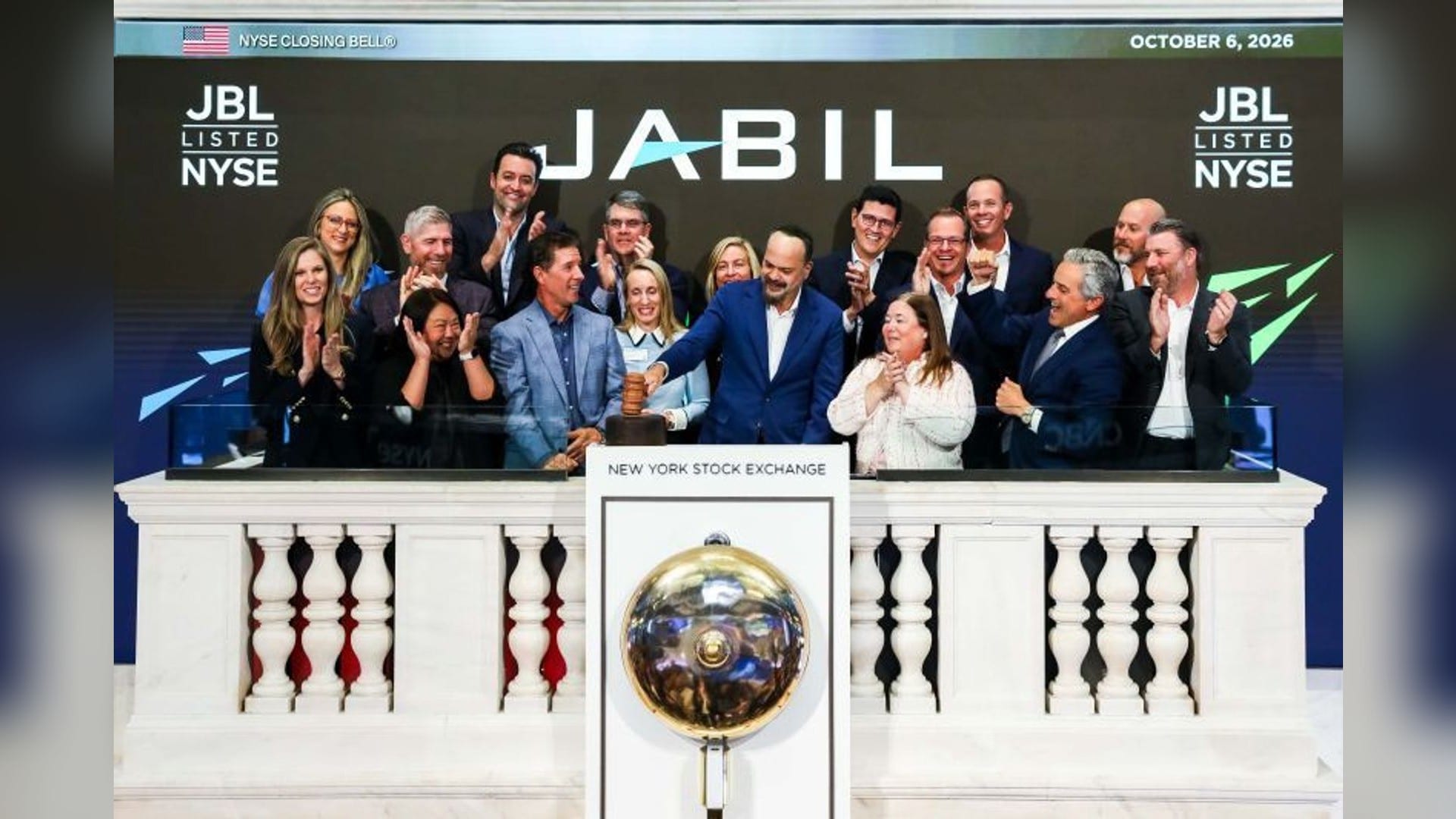 Jabil CEO Mike Dastoor, center in blue, and Jabil leadership ring the Closing Bell at the New York Stock Exchange on October 6, 2026, marking the company's 60th anniversary