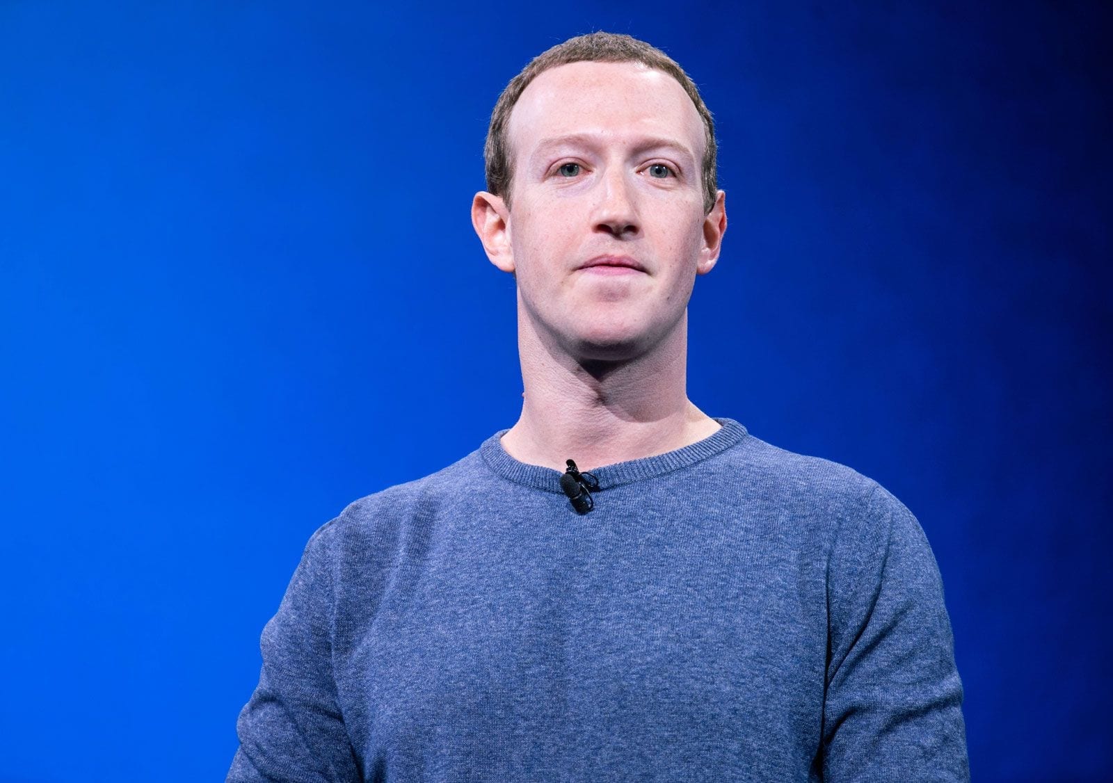 Mark Zuckerberg, Meta's chief executive, on stage against a blue background.