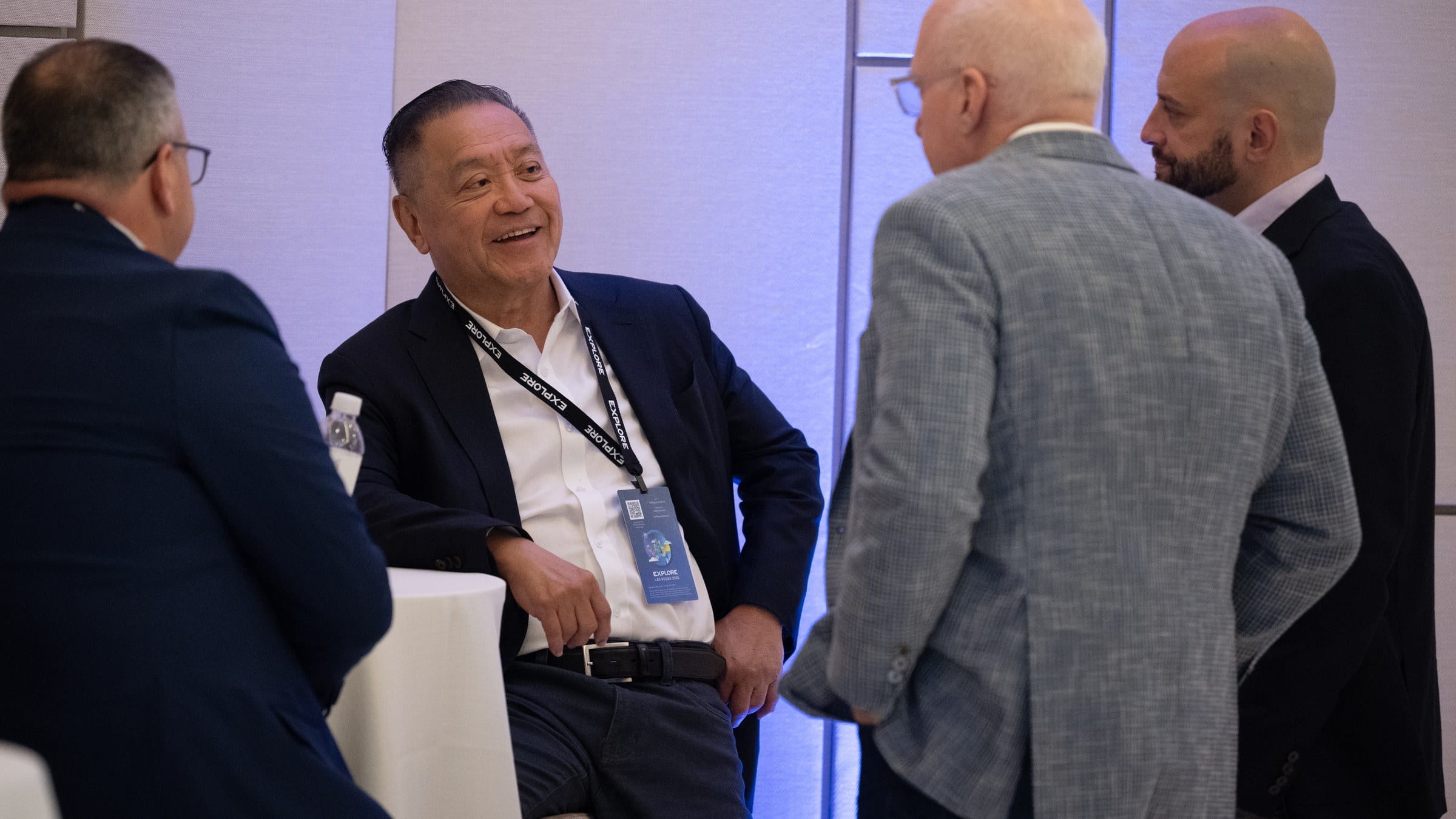 Broadcom chief executive Hock Tan talking with customers at an executive briefing